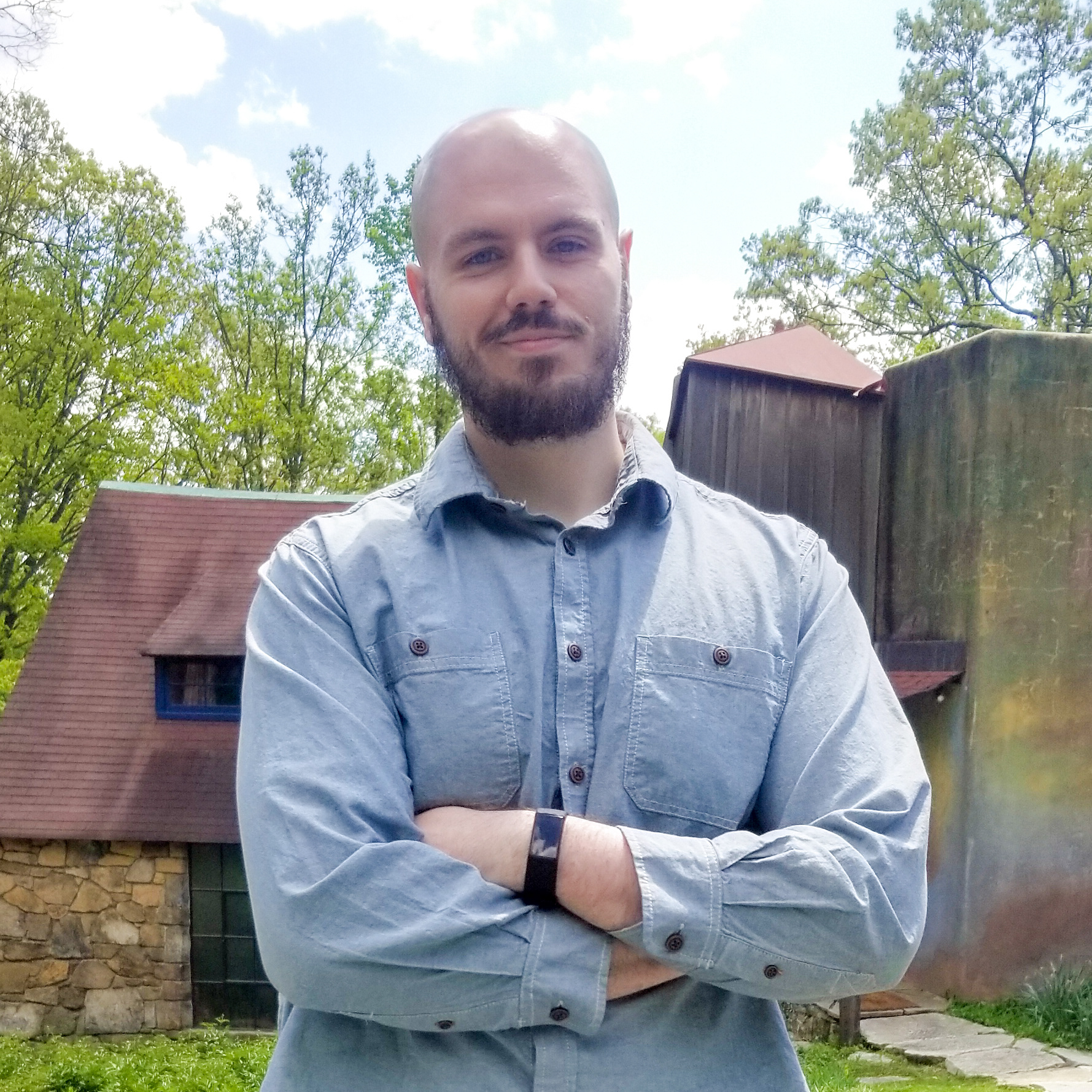 Owner and graphic designer Josh Weber poses with a smile.