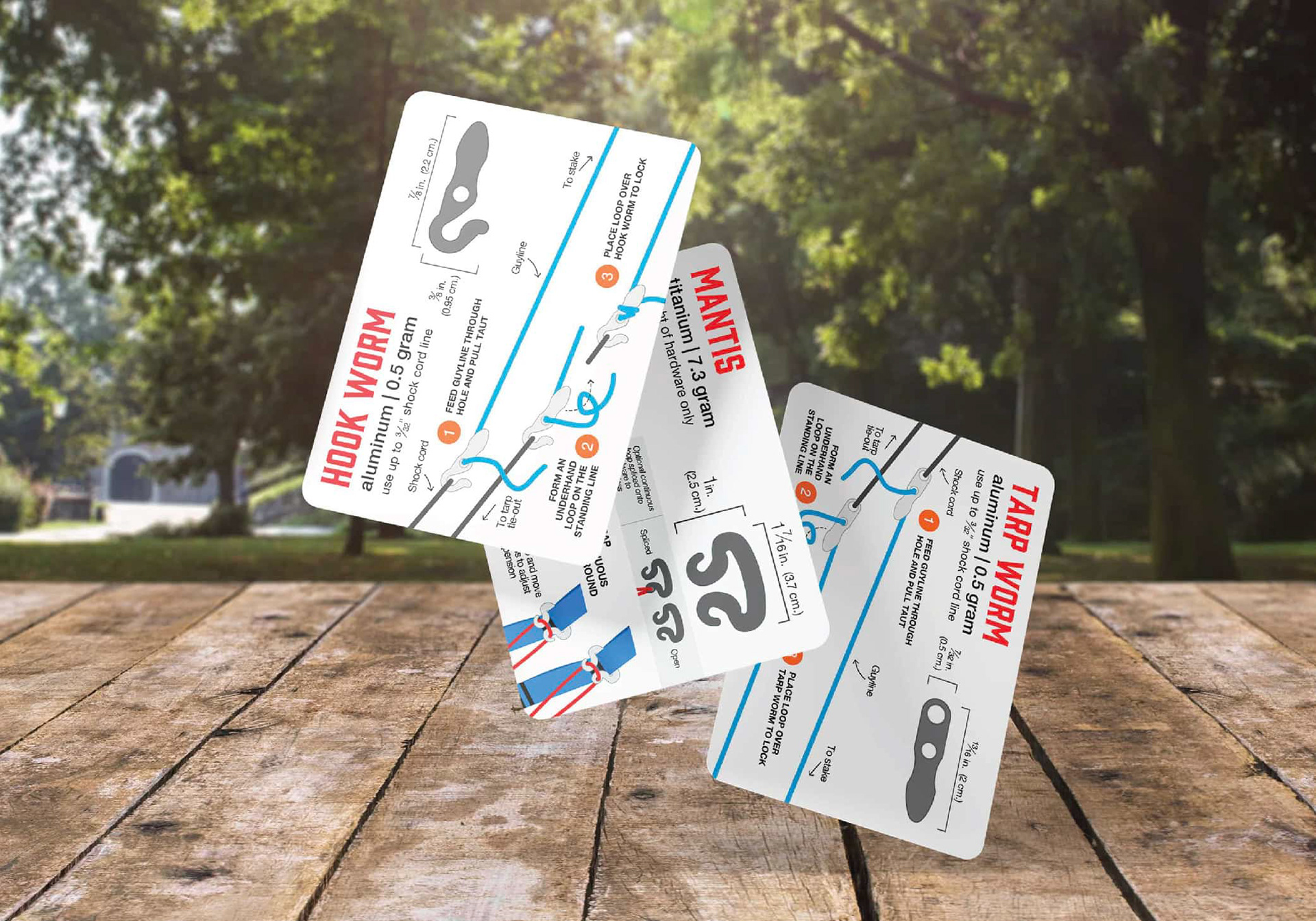 three collector cards showing usage of camping hardware in use for tarps and hammocks