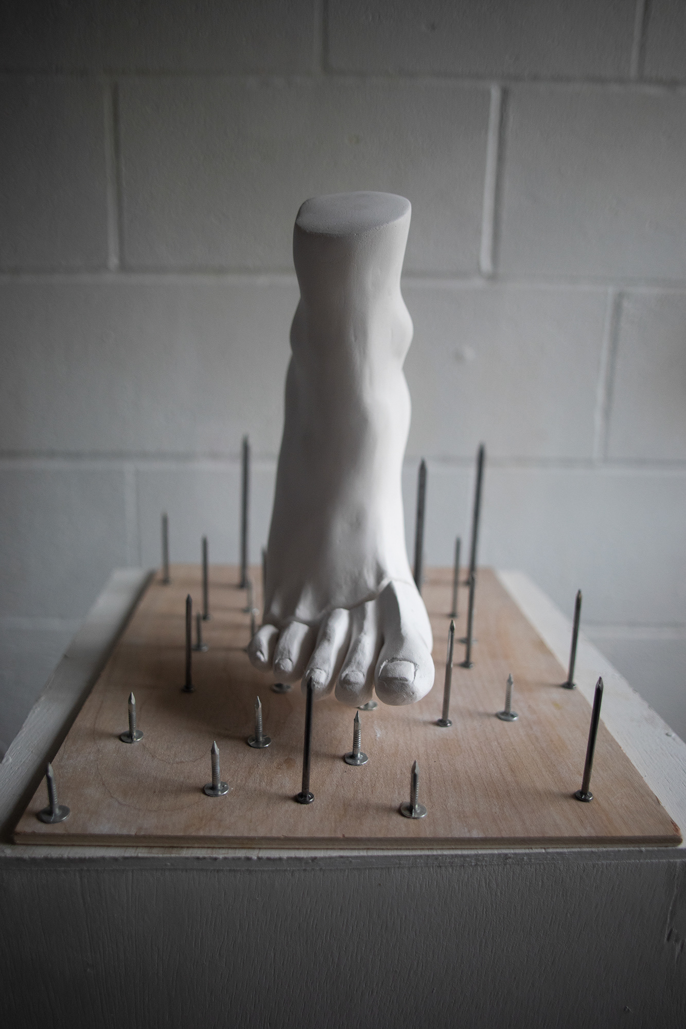 McCall made this piece to represent her own experience with domestic violence. To McCall, this sculpture is meant to show how delicate she had to be during times when she felt something as simple as a footstep could lead to her own harm.