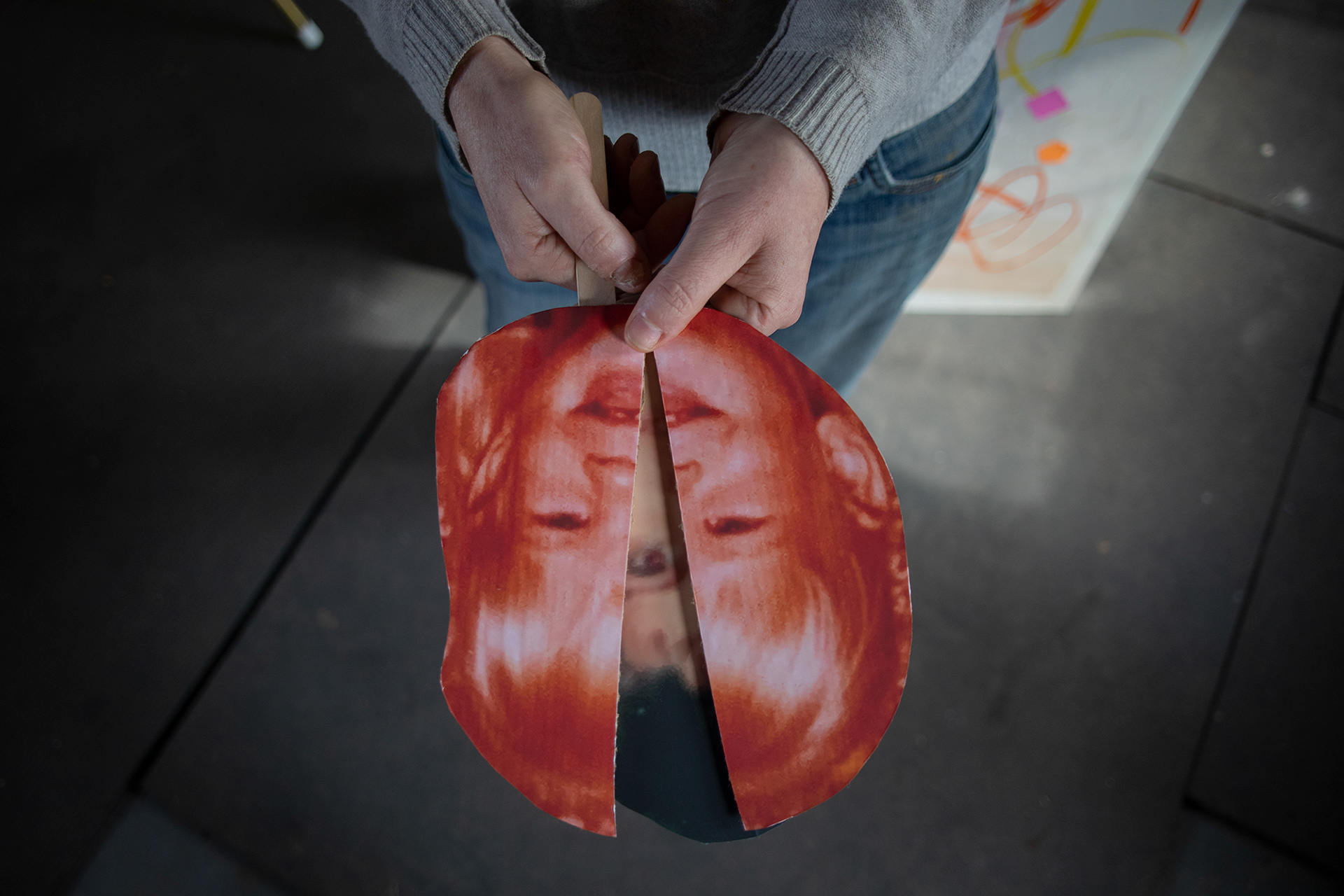 Couture holds an image of her younger self. For much of her career, Couture’s art focused on the “personal and political.” Specifically, her work was influenced by her rural background and humanity’s relationship with place. Her focus shifted when she became unexpectedly pregnant at 42. Since the birth of her now two-year-old daughter, much of Couture’s work has centered around parenthood, post-partum depression and her own childhood.