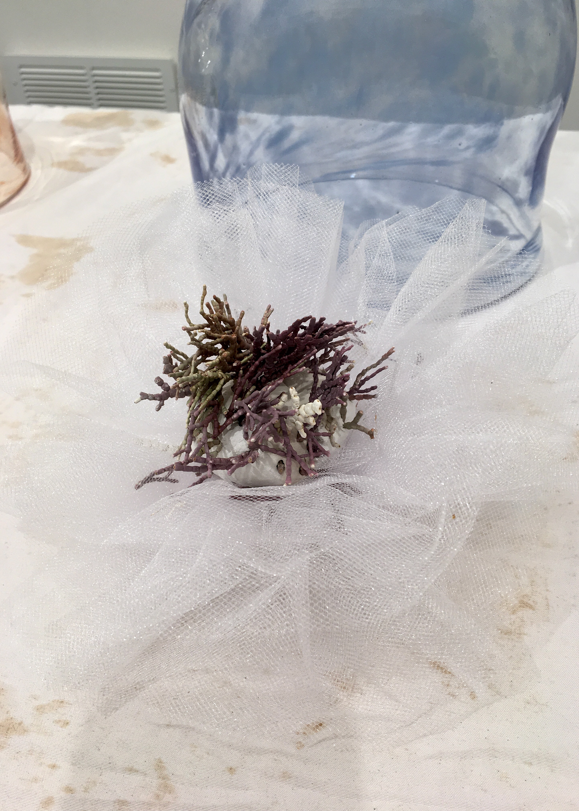 Winter: ivory and amethyst coral, harvested from the coast of California, veiled by bundles of white tulle