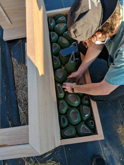 Pots being placed into their frame.