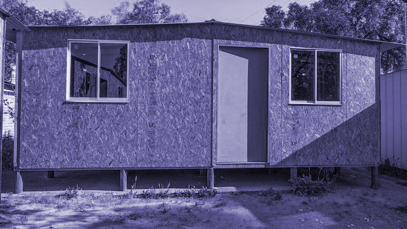 Front exterior view of the 19 m² emergency shelter built with OSB panels.