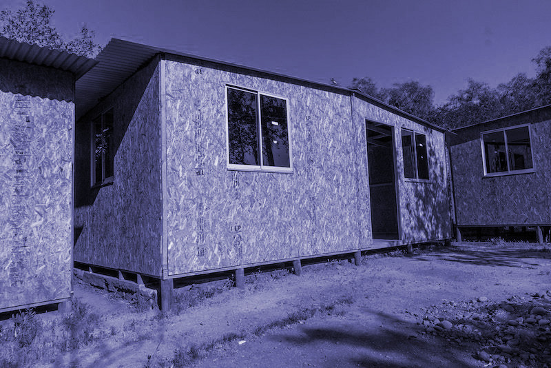 Exterior view of the 19 m² emergency shelter built with OSB panels.