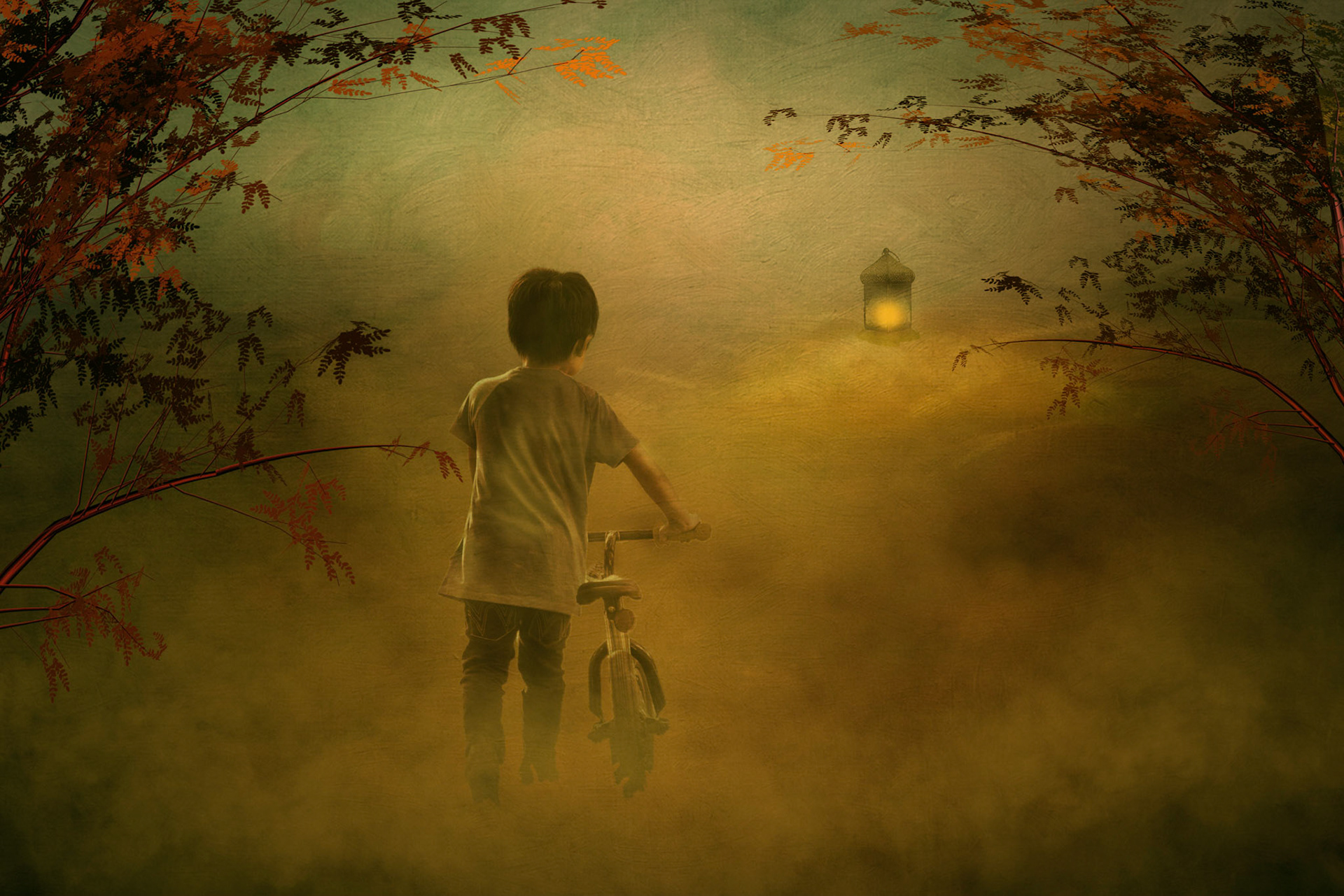 Little toddler boy repairing his first bike