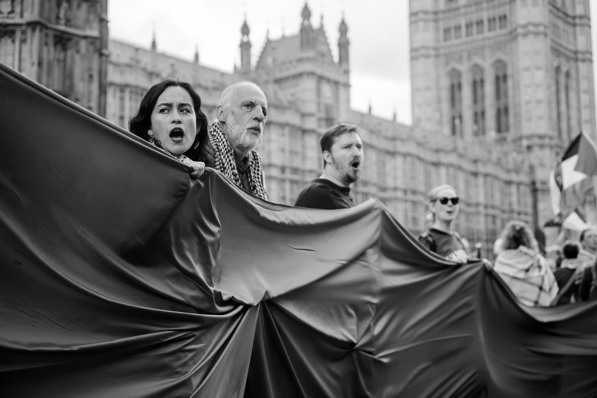 London, UK. 06 JUN 2025. Protesters wearing red surrounded Parliament, demanding that the UK government stop arming Israel.Aubrey Fagon / Alamy Live News