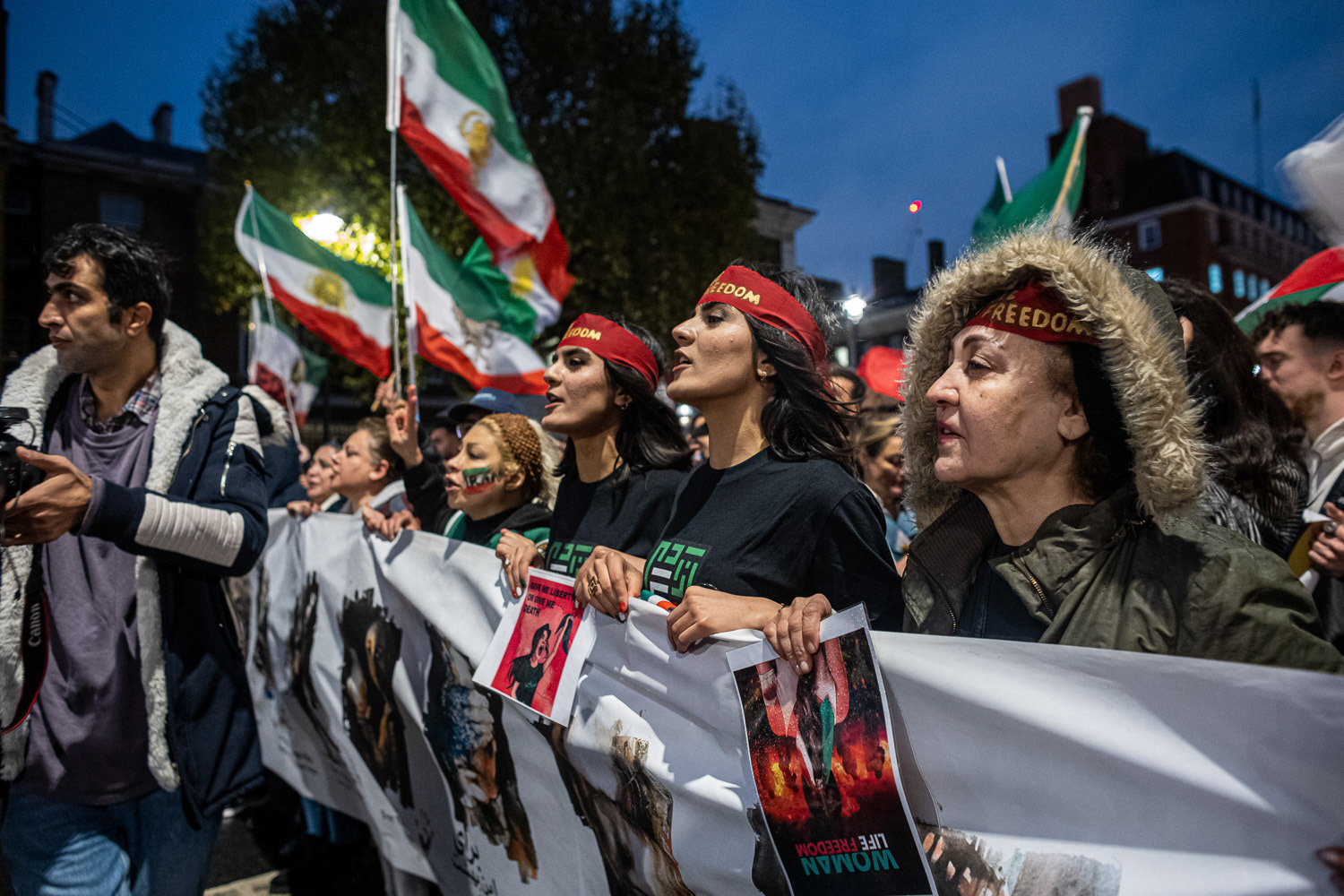 British-Iranian activist protesting against the Islamic Republic regime in Iran. Gathered outside Downing Street, demanding the closure of the Iranian Embassy in London.