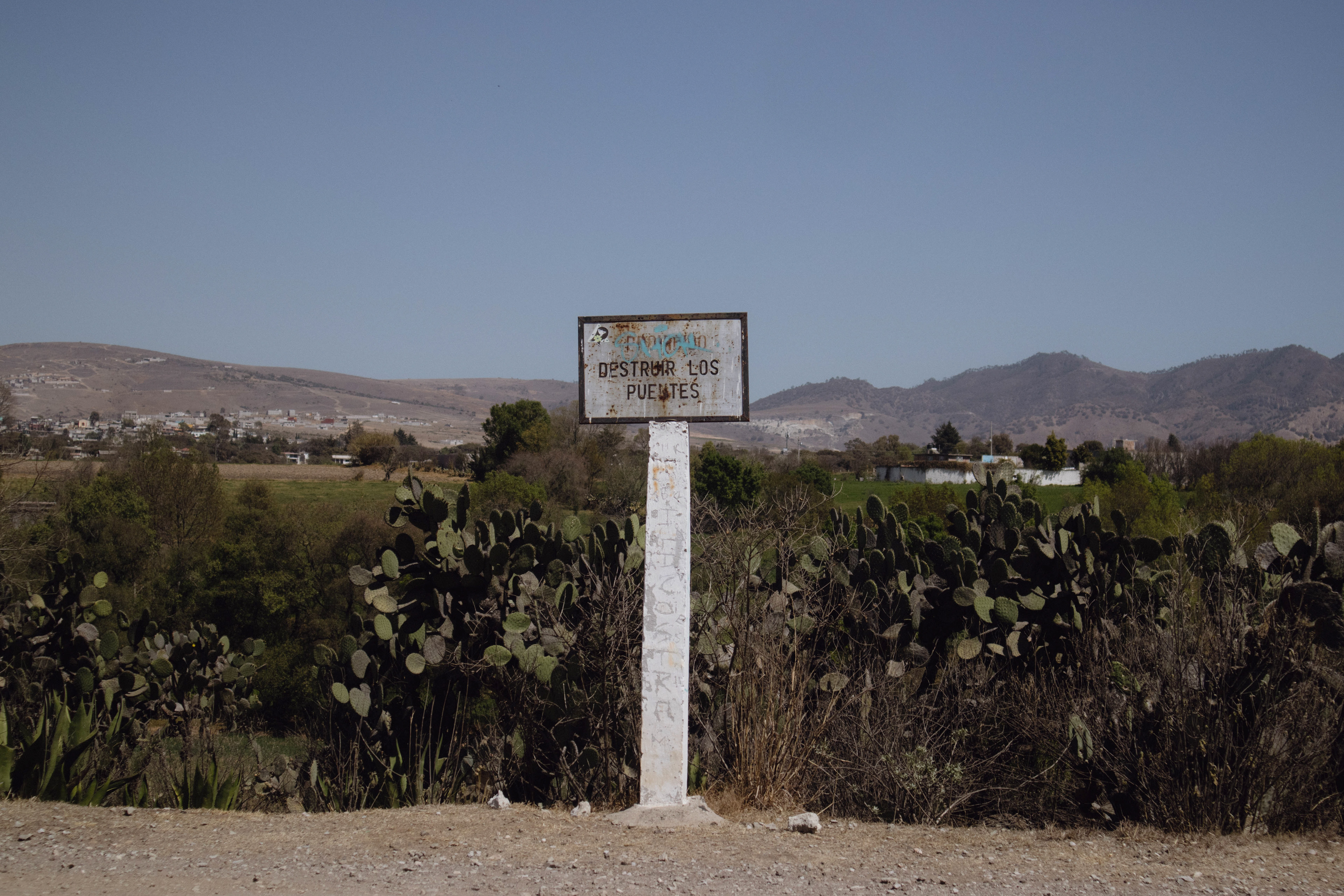 Mom wrote about the need for two strong pillars to build a bridge. The sign ordered "Destroy the bridges".
