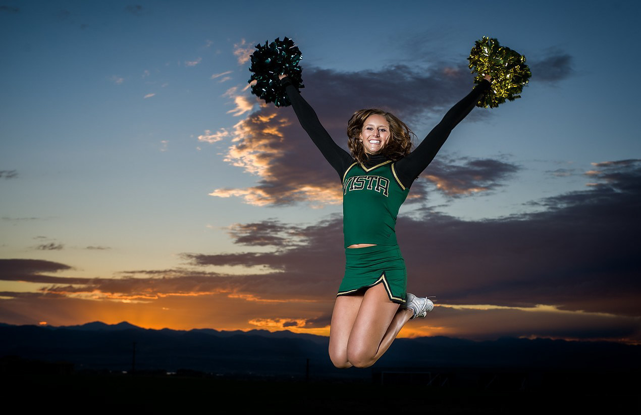 Nicole. Shot during what photography calls "the golden hour" (30 minutes before sunset / 30 minutes after sunrise). Yes, flash was used to overpower the sun.