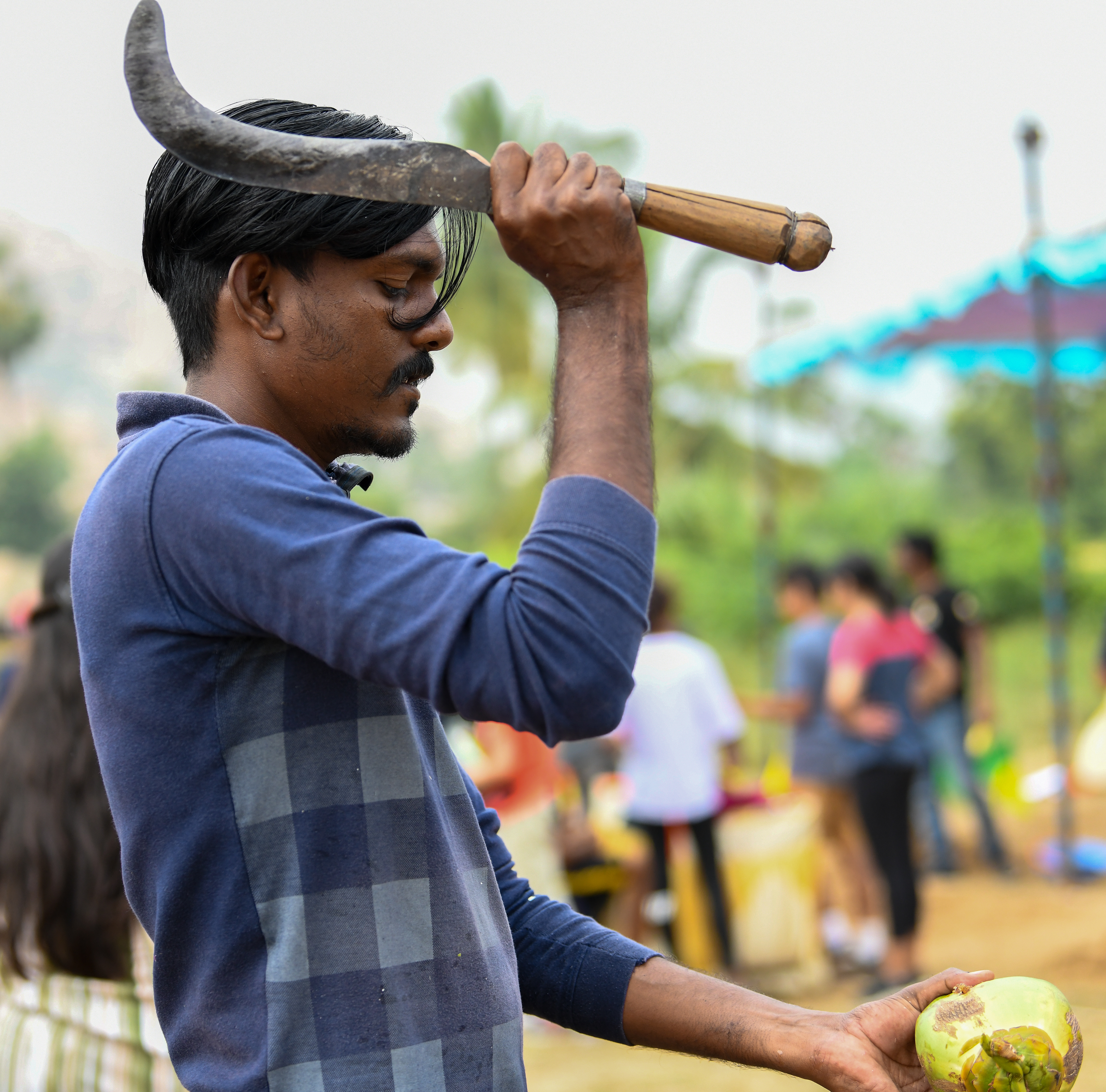 Fresh coconut juice. Amazing to watch how close he comes to his fingers. India