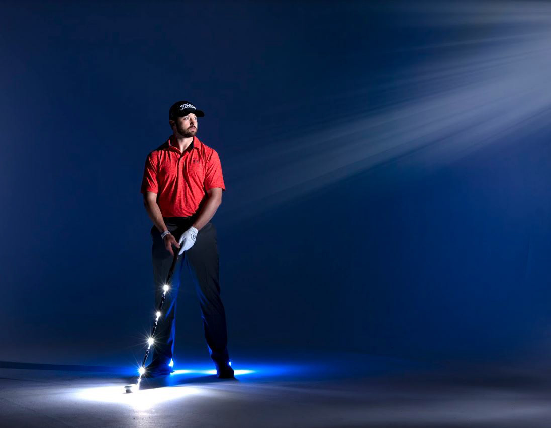 Notice the four pin-lights that are taped to the golf club, plus two more blue gel lights behind  each foot. 