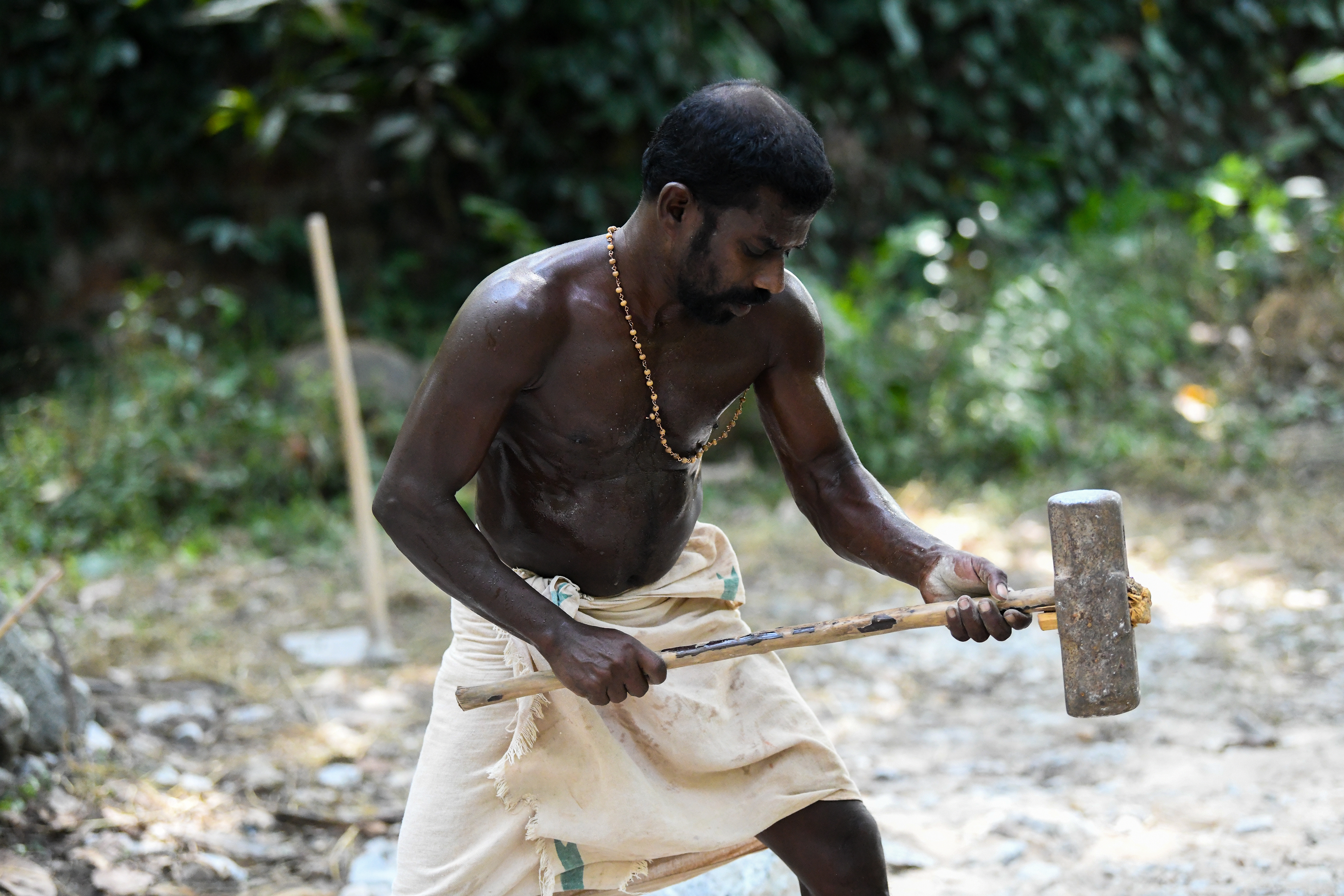 Breaking (Granite) rocks in the hot sun - seriously. Kerala, India.