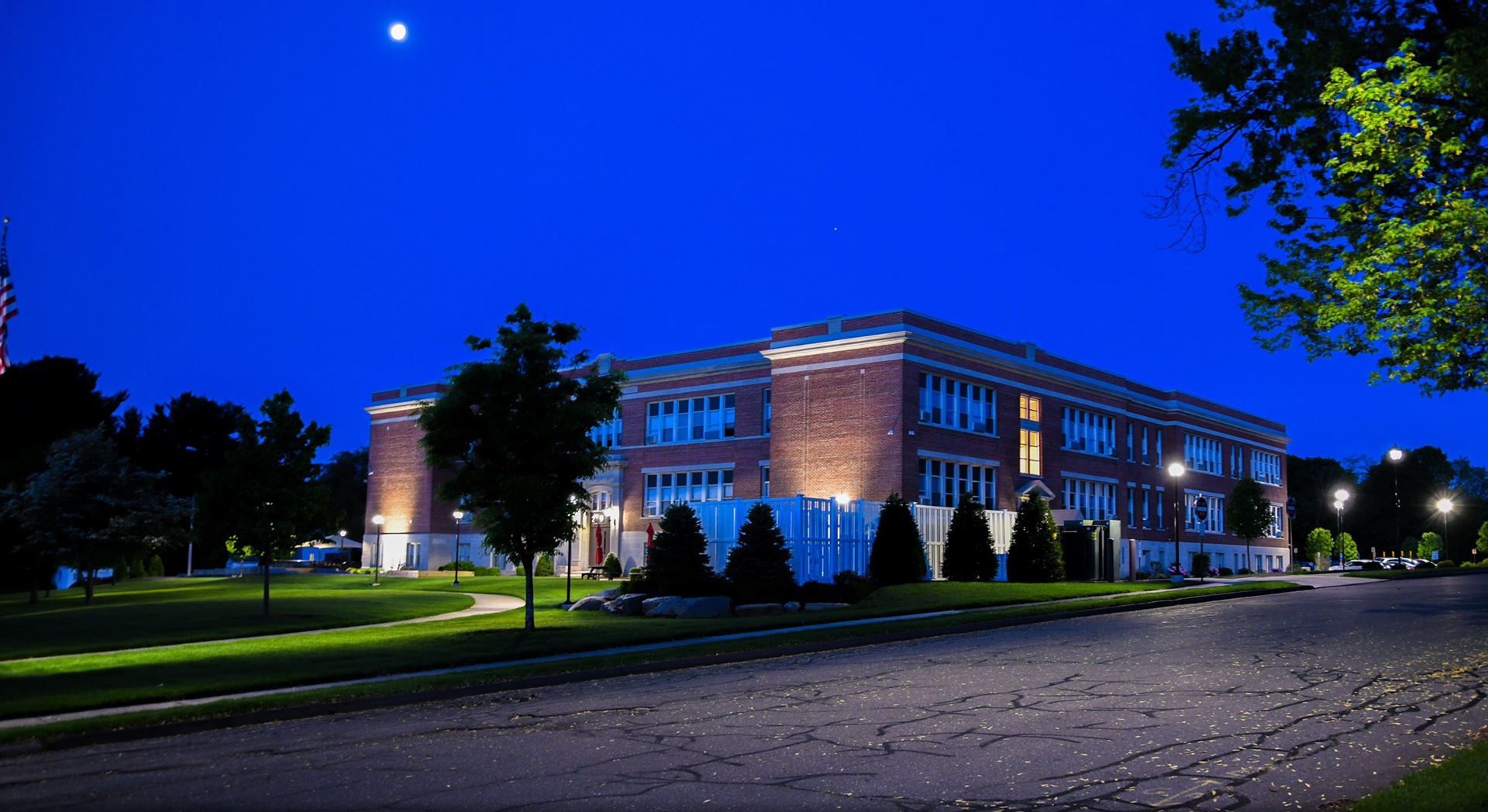 Dawn over my beloved elementary school.  And yes, that's the moon. The sun is rising behind me. 