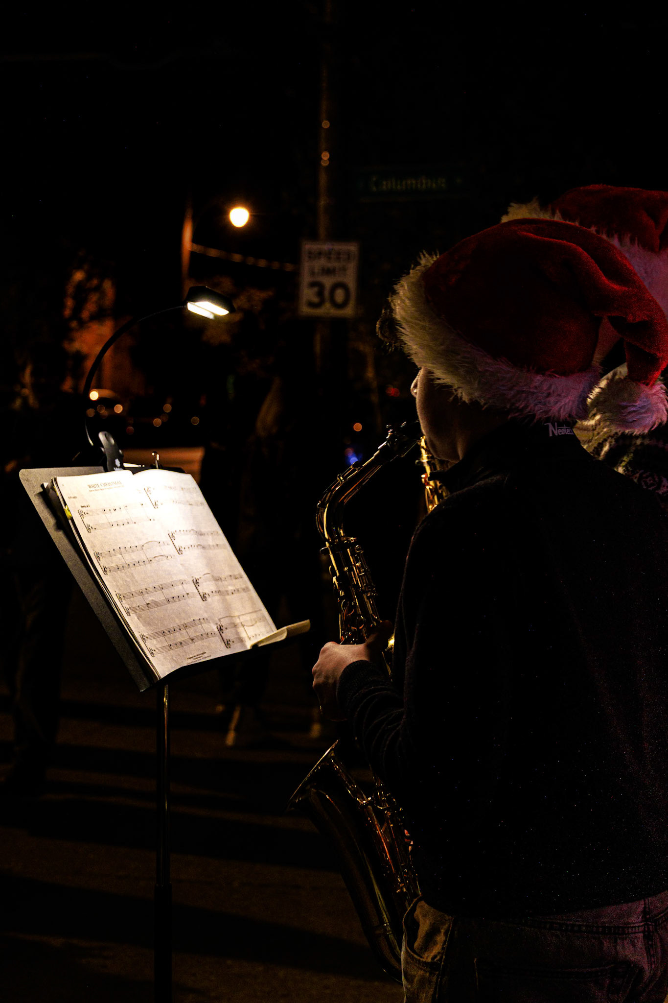 A couple of teens playing Christmas music in German Village, Columbus OH, 2024