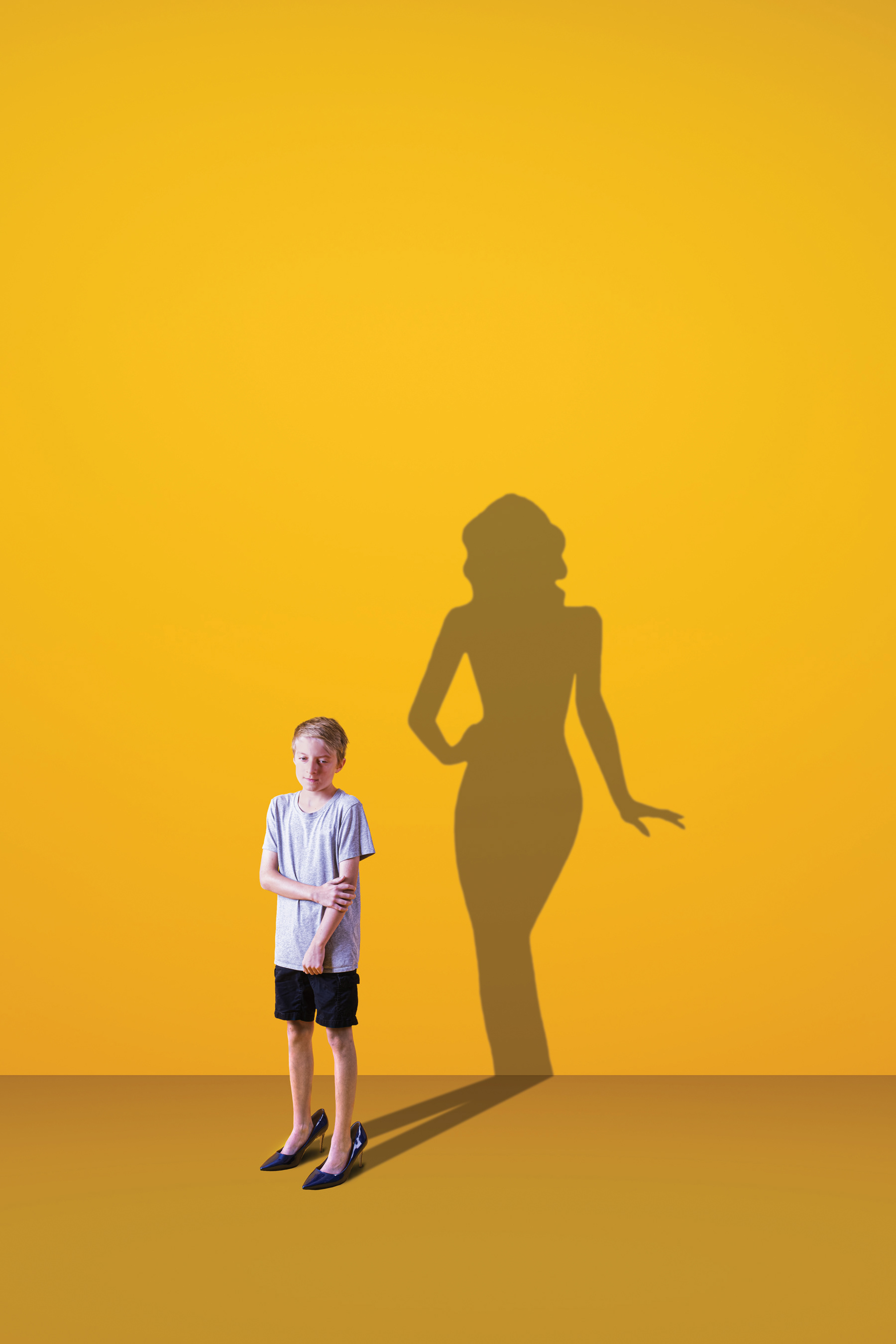 A Powerful Dream - This piece is showing a young boy standing shyly in a pair of heels. From him, a stark shadow shows the silhouette of a grown drag queen. The piece is meant to show the power the boy will feel once he is able to live as he truly feels.   This work has personal meaning as well. I have created a drag persona in the last couple of years, and it wasn't until I got into drag my first time that I understood the powerful feeling one gets from it. It's exhilarating and empowering in the best way.