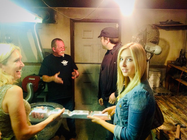 Songwriter attendees holding a piece of grammium at the Grammy Man's shop