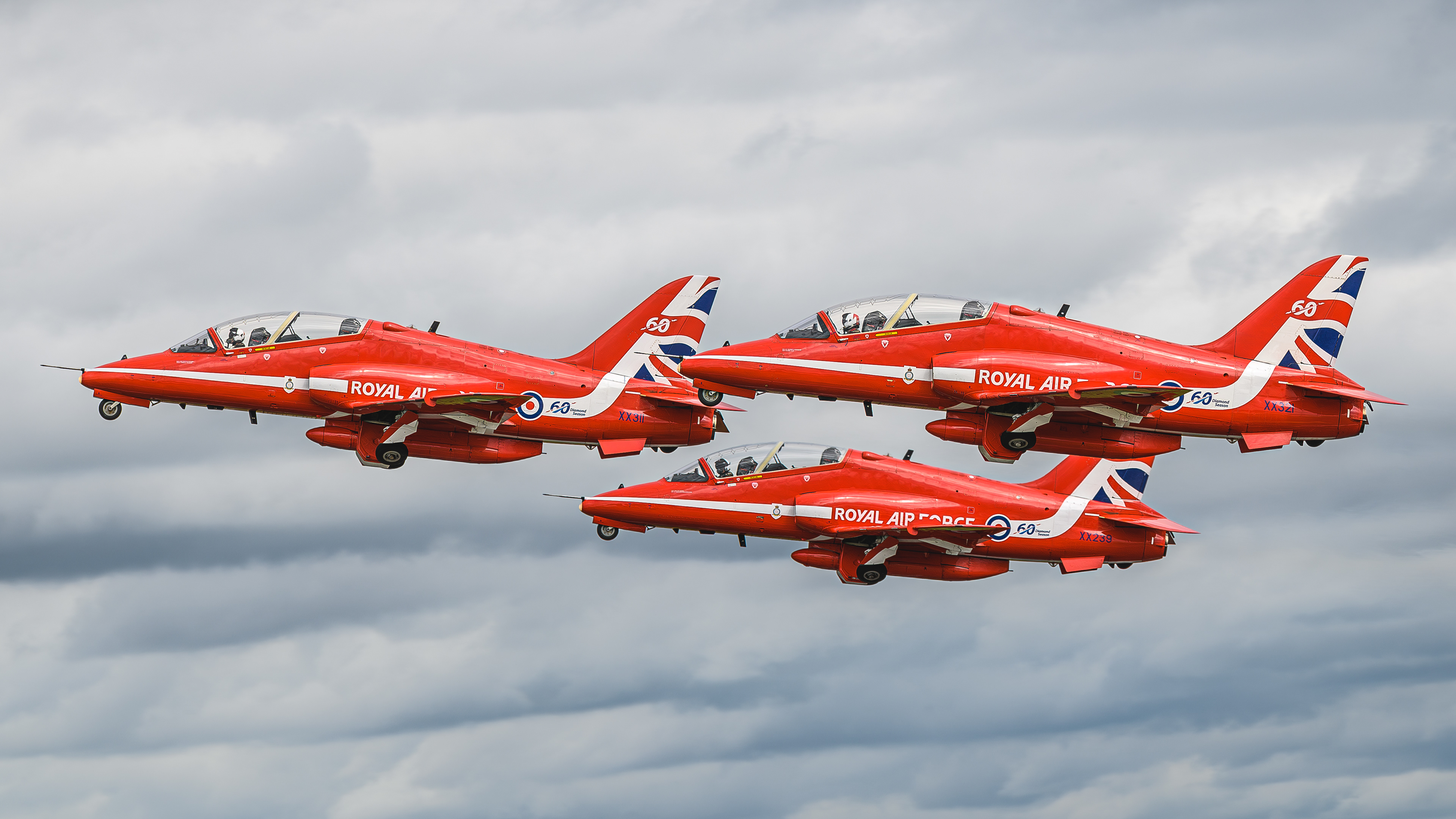 Three BAe Hawk T1s from the RAF Red Arrows leaving RAF Fairford in July 2024
