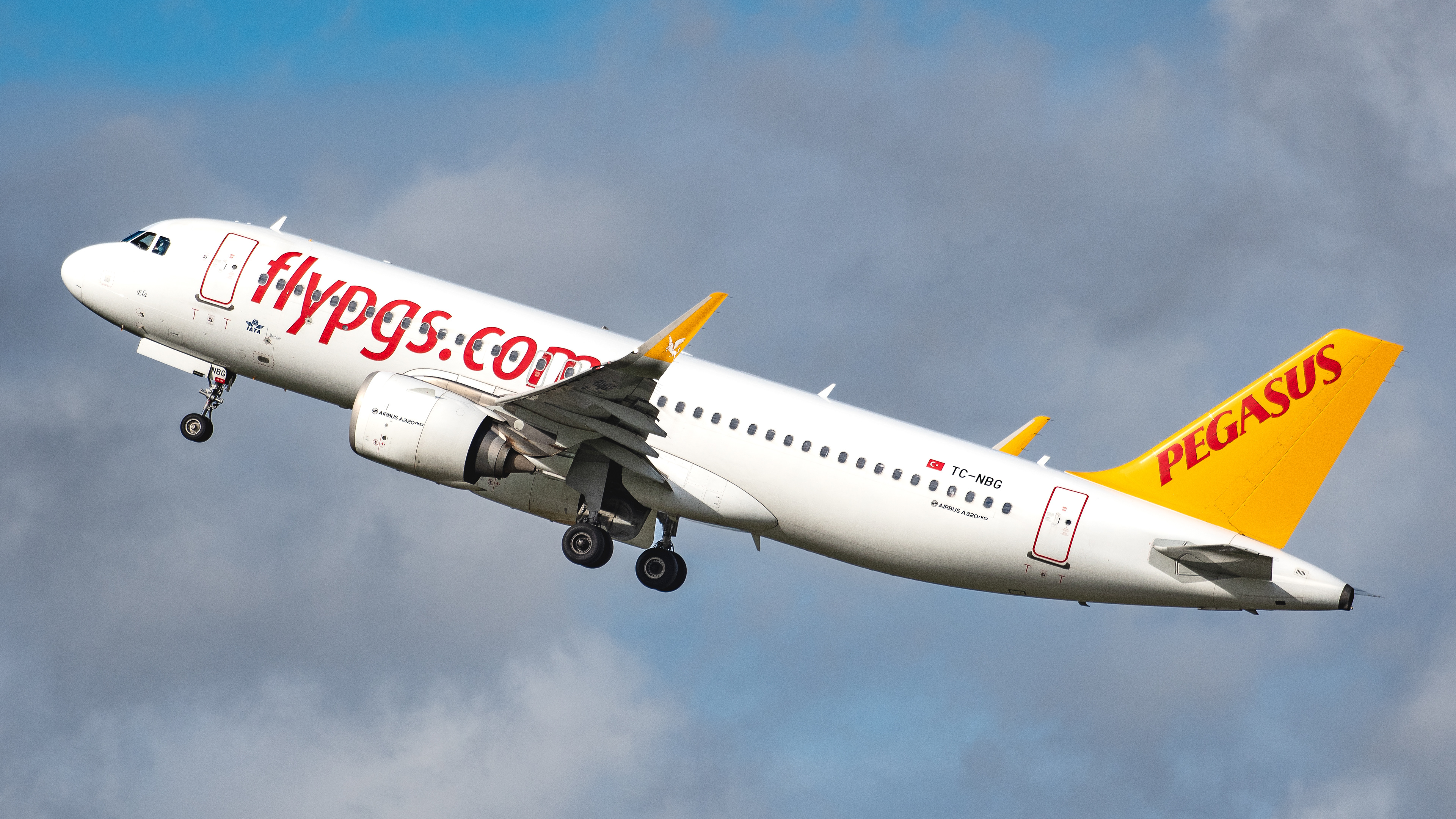 Airbus A320 operated by Pegasus departing Stansted Airport. Registration TC-MBG.
