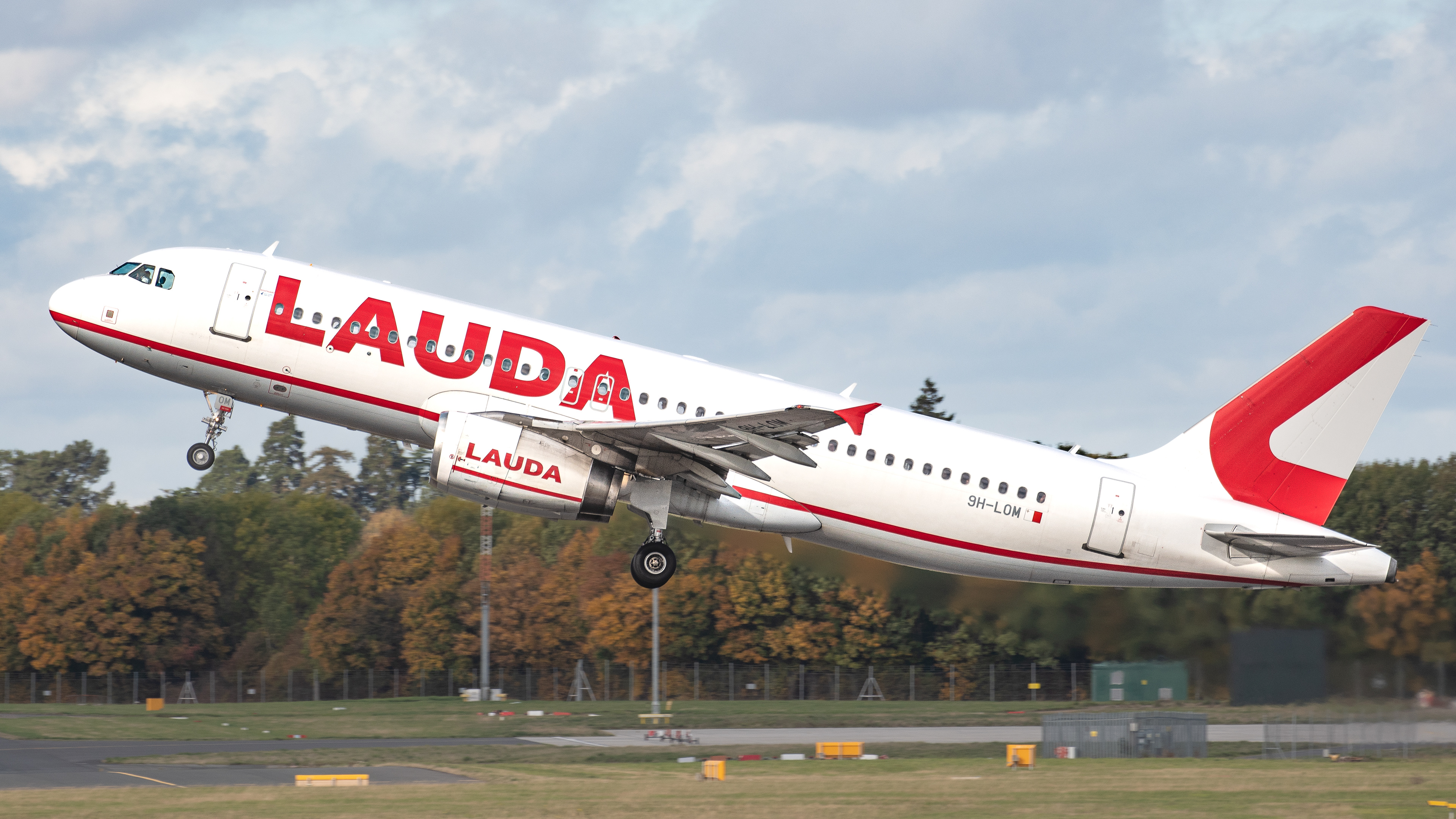Airbus A320 operated by Lauda Europe departing Stansted Airport. Registration 9H-LOM.