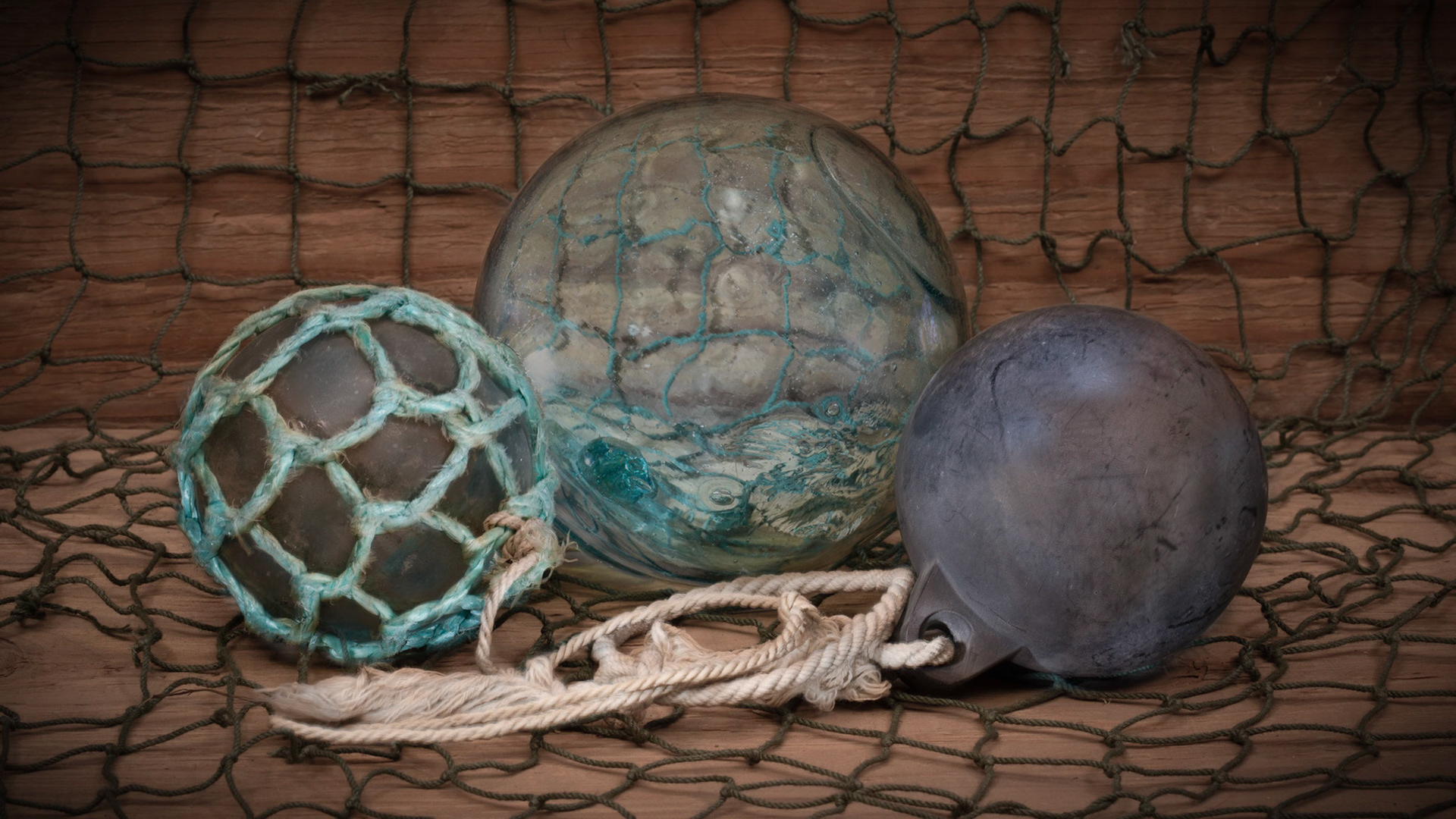 Three Fishing Floats and Net