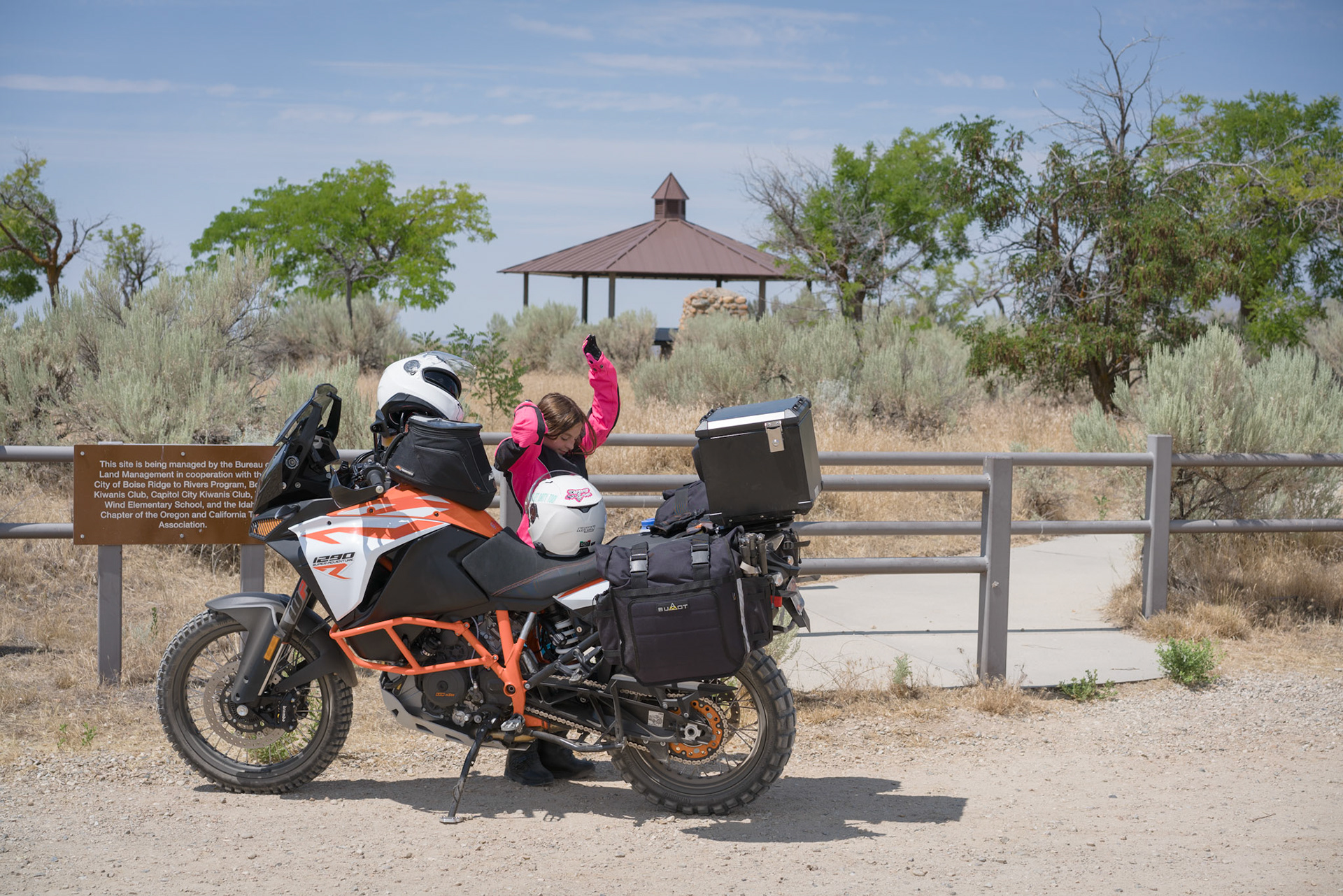 It may be the roughest part of the whole ride but Brenna seemed to like the rocky trail from Boise to Bonneville Point just fine. It’s hot here in the open, on a parched hill overlooking the river valley, so we’re only pausing a minute to make sure our luggage remains well secured.“Can I go look?” Brenna asks, nodding toward the gazebo in the fenced area. She’s been here a few times but doesn’t remember it well.“Of course,” I answer.