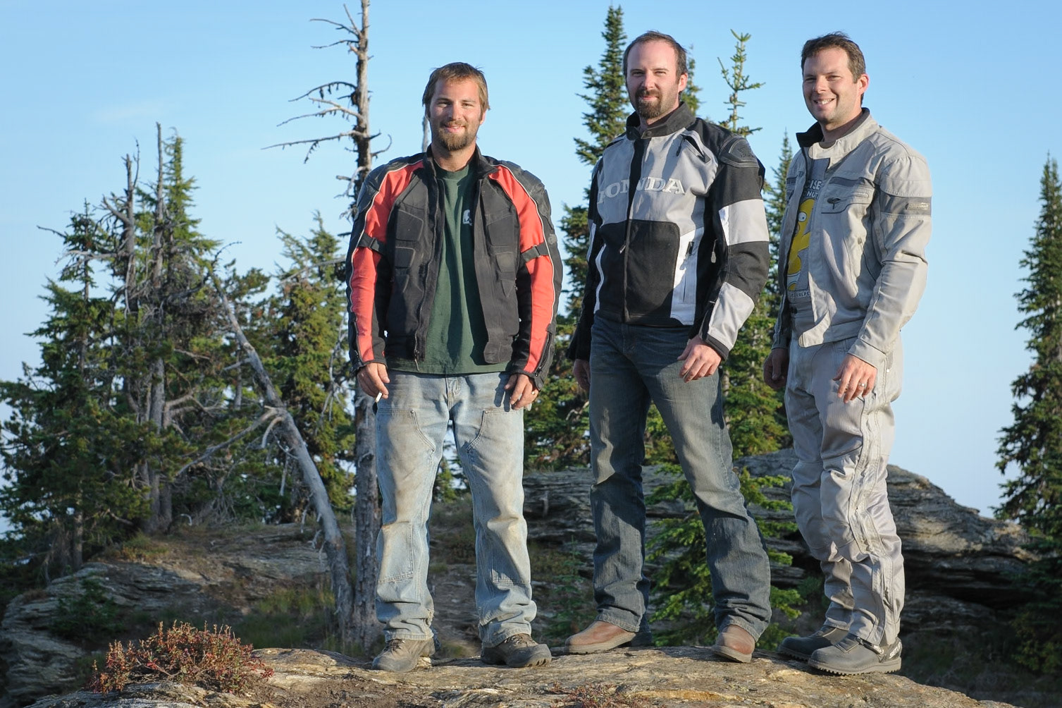 With that drama behind us, we posed for a timer shot, for which I offered my cheesiest smile.A road and outhouse were nearby so, although this was a nice spot, it didn’t feel like camping yet. We decided we wanted to get up on the ridge. There was a hint of trail we followed up and then just rode cross country.