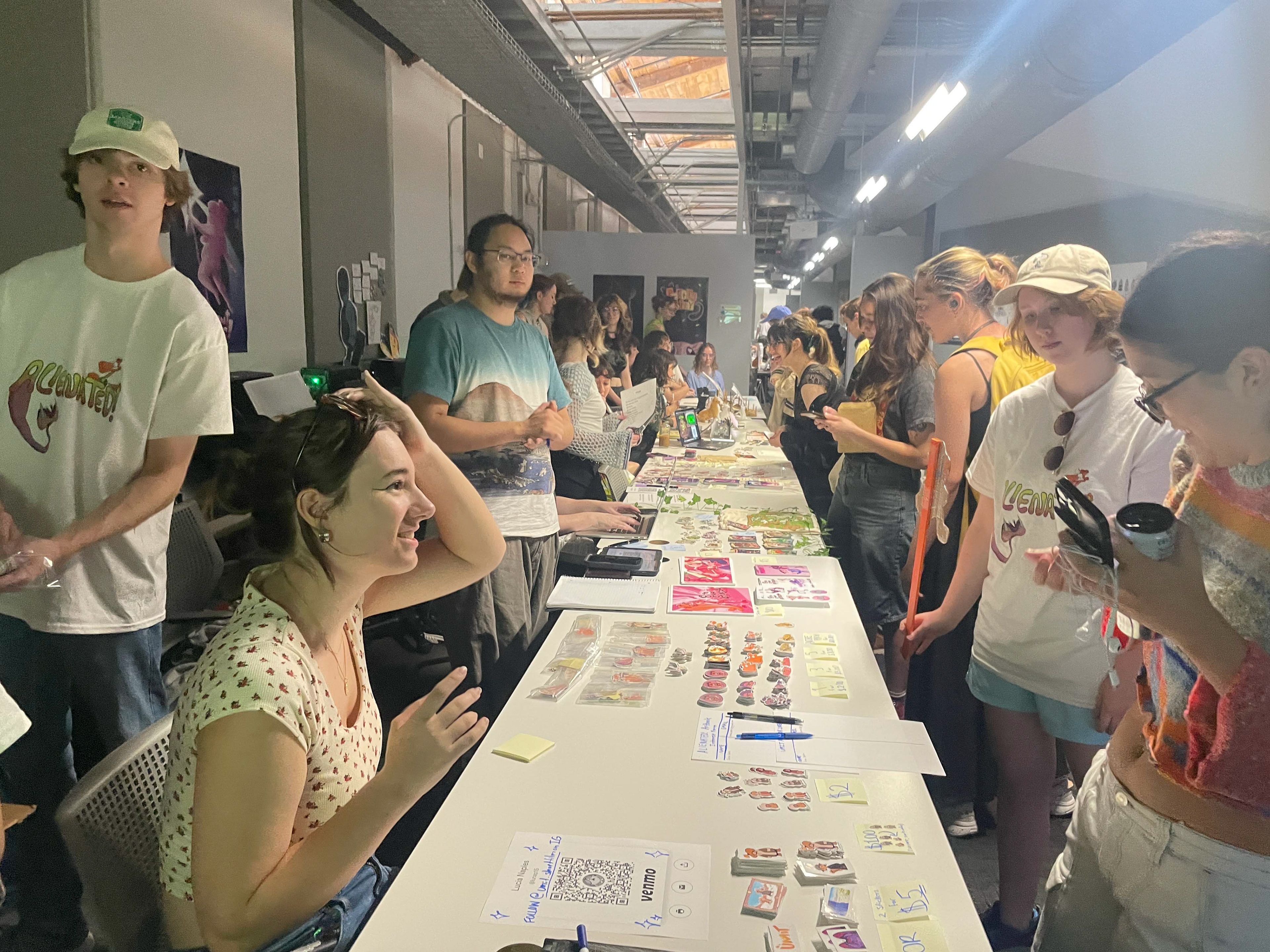 Former 2DX President Lucia Naples tabling at the merch sale