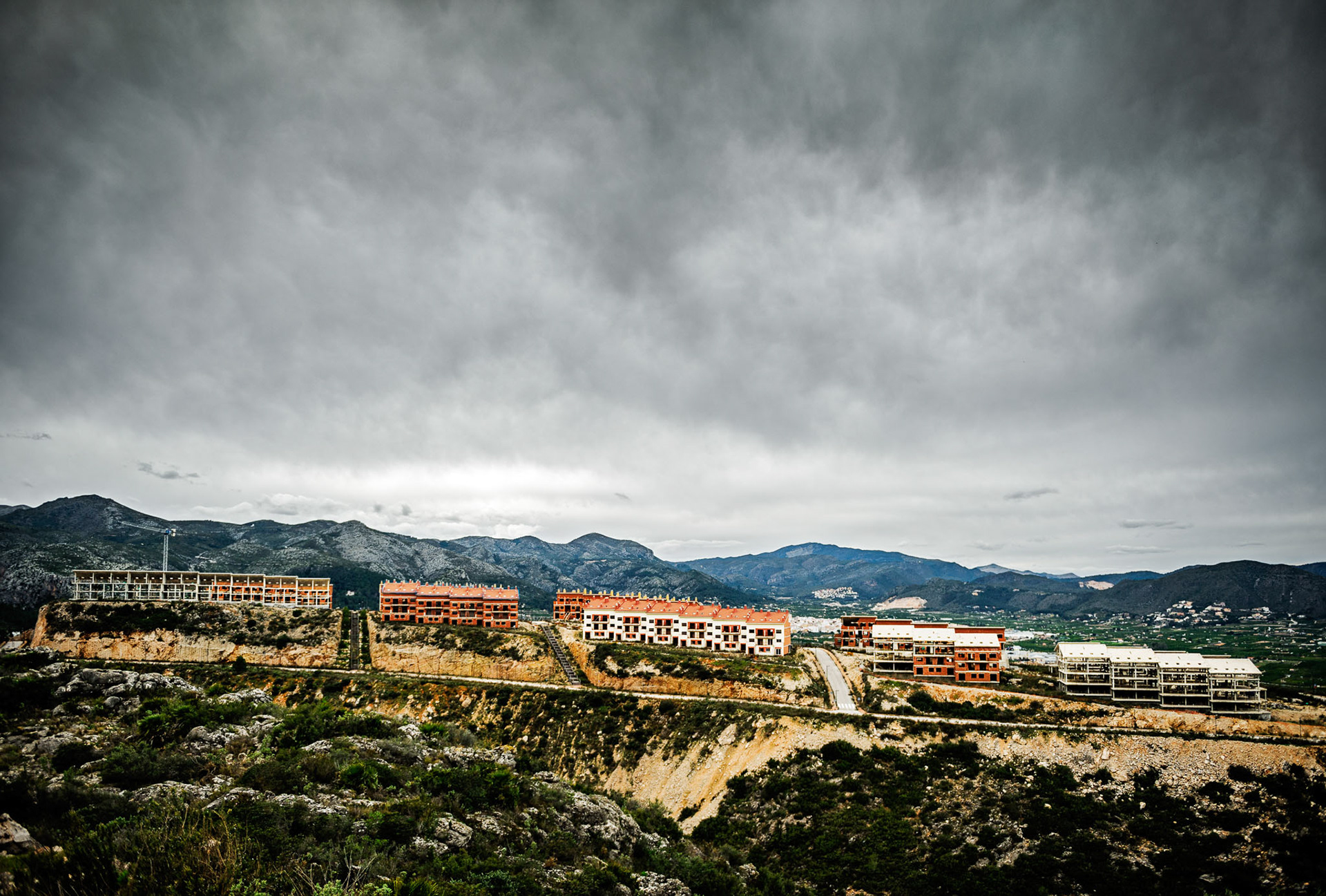 “Bellarotja” Residential Development. Pego, Alacant, Comunitat Valenciana. The original plan contemplated 2,000 houses and a golf course, but when the constructor went bankrupt in 2008, the project stopped abruptly. This was a hard blow on the City's economy because, in order to pay regular expenses, it had already spent €1.8 million from a fund that was explicitly aimed for the infrastructures affected by the development. However, Bellarotja has been abandoned and decaying for seven years, and there are no plans for finishing it, so no new infrastructures are needed. Thus, the City has to return the money from the fund, blocking the possibility of new investments.