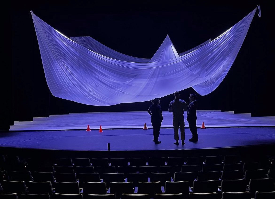 Photo of a stage with white cloth hanging like a sail