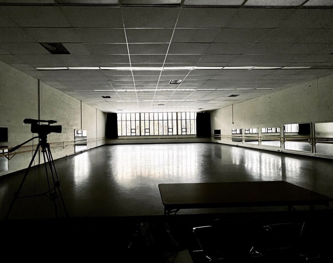 Rehearsal studio. There are mirrors on the right and glass windows in the back
