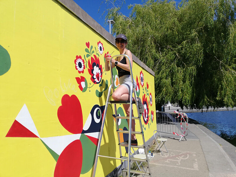 Aga Grandowicz painting the mural celebrating Polish-Irish connections. Portobello, Dublin.