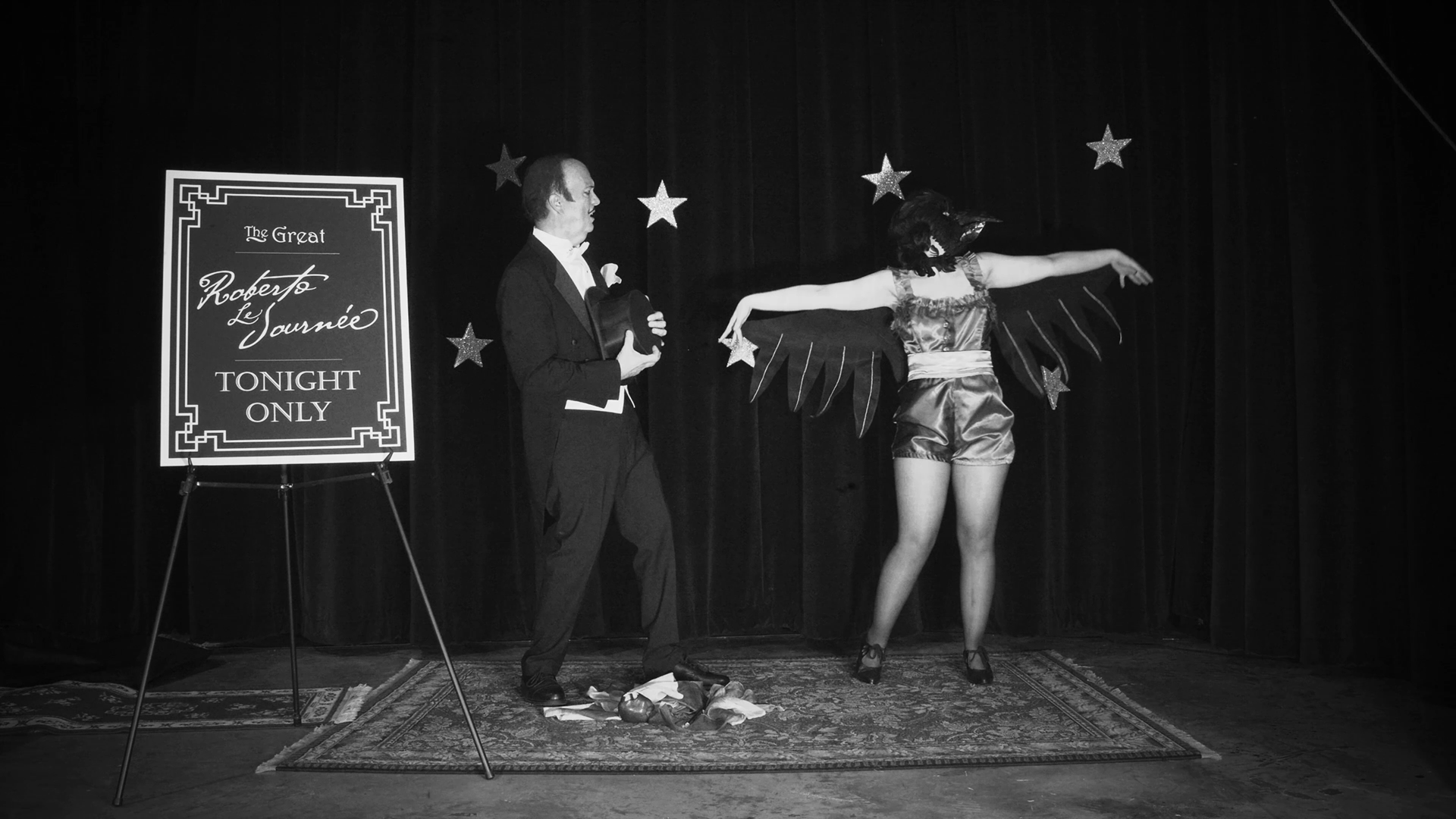 Cami Roebuck as The Magician's Assistant with Jeff Roebuck as The Magician in S1E3 of The 12 Sacred Moons "March: The Crow Moon" written and directed by Cami Roebuck. March 2020.