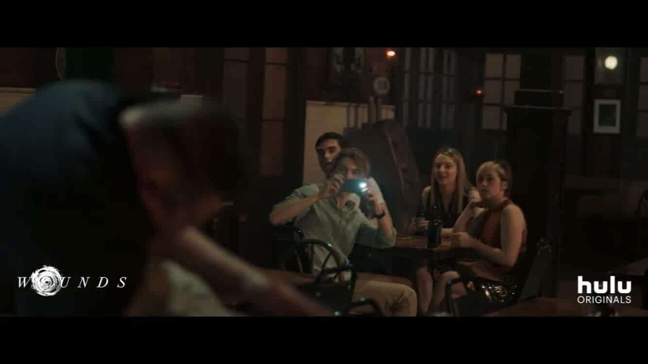 Cami Roebuck as College Girl #2 with Noelle Robinson, Alexander Biglane, Ben Sanders, and Brad William Henke in Wounds directed by Babak Anvari. October 2019. Watch now on Hulu!