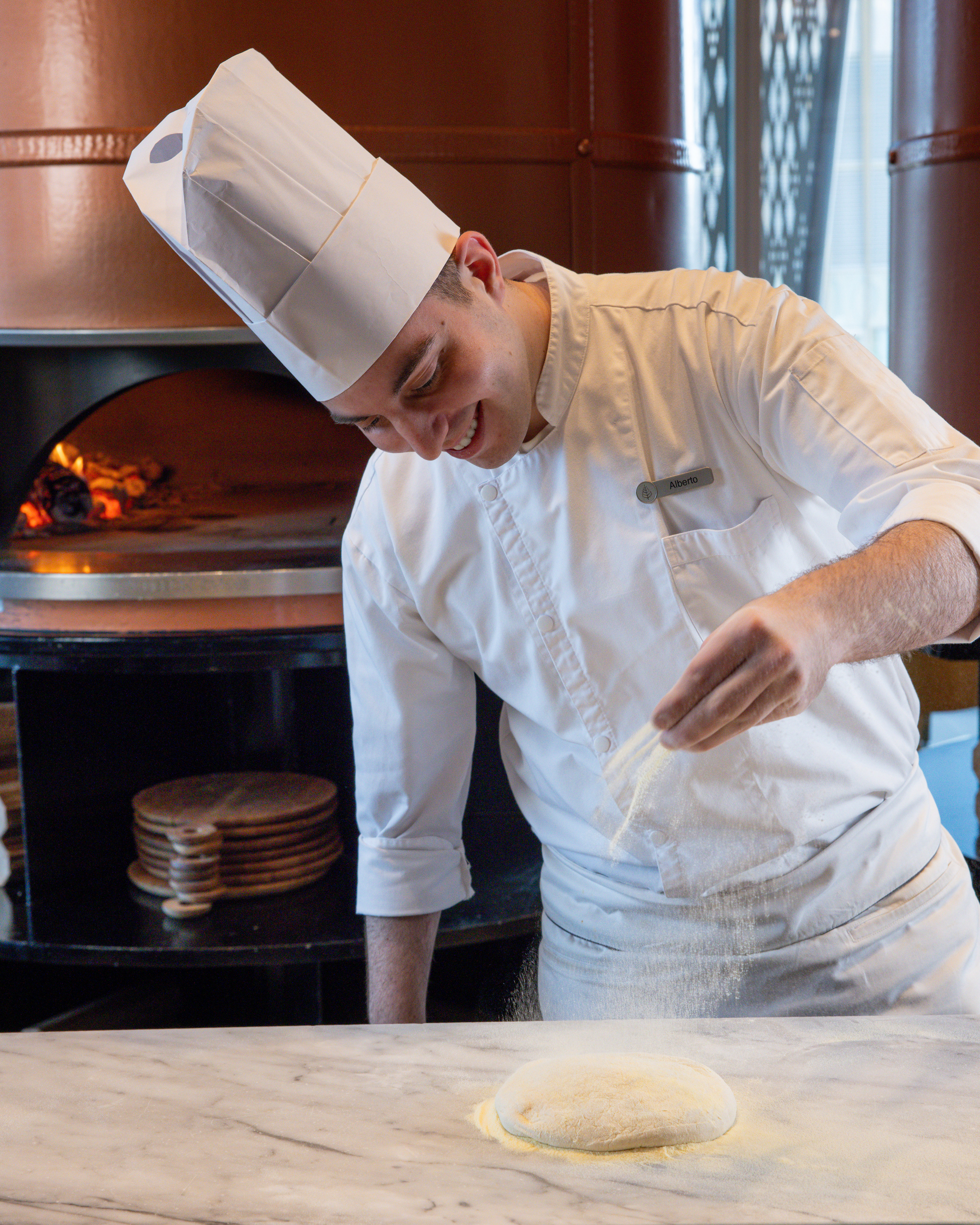 Savor the story behind every frame. The ambiance, the artistry, the aroma — Dai Forni, Four Seasons Kuwait, through our lens