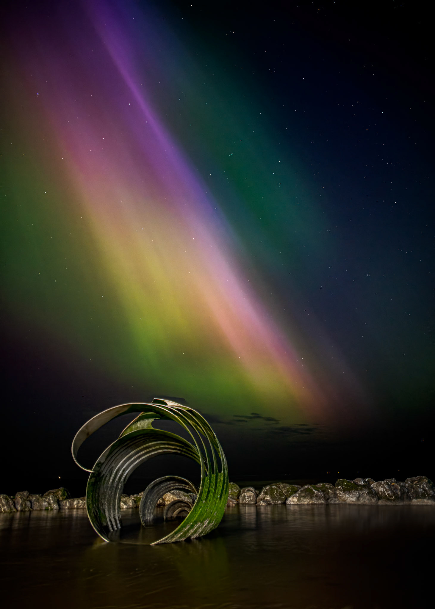 A stunning display of the northern lights, with Mary's shell and the Irish sea lapping around the sculpture as the tide was slowly coming in.