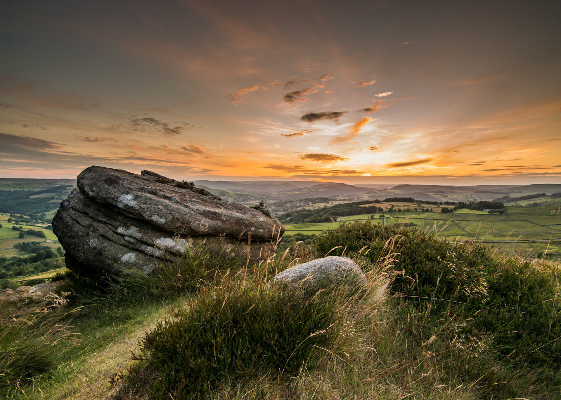 A view of a summer sunset over the Derwent valley in the Peak District, taken from Surprise View near Hope and Hathersage.