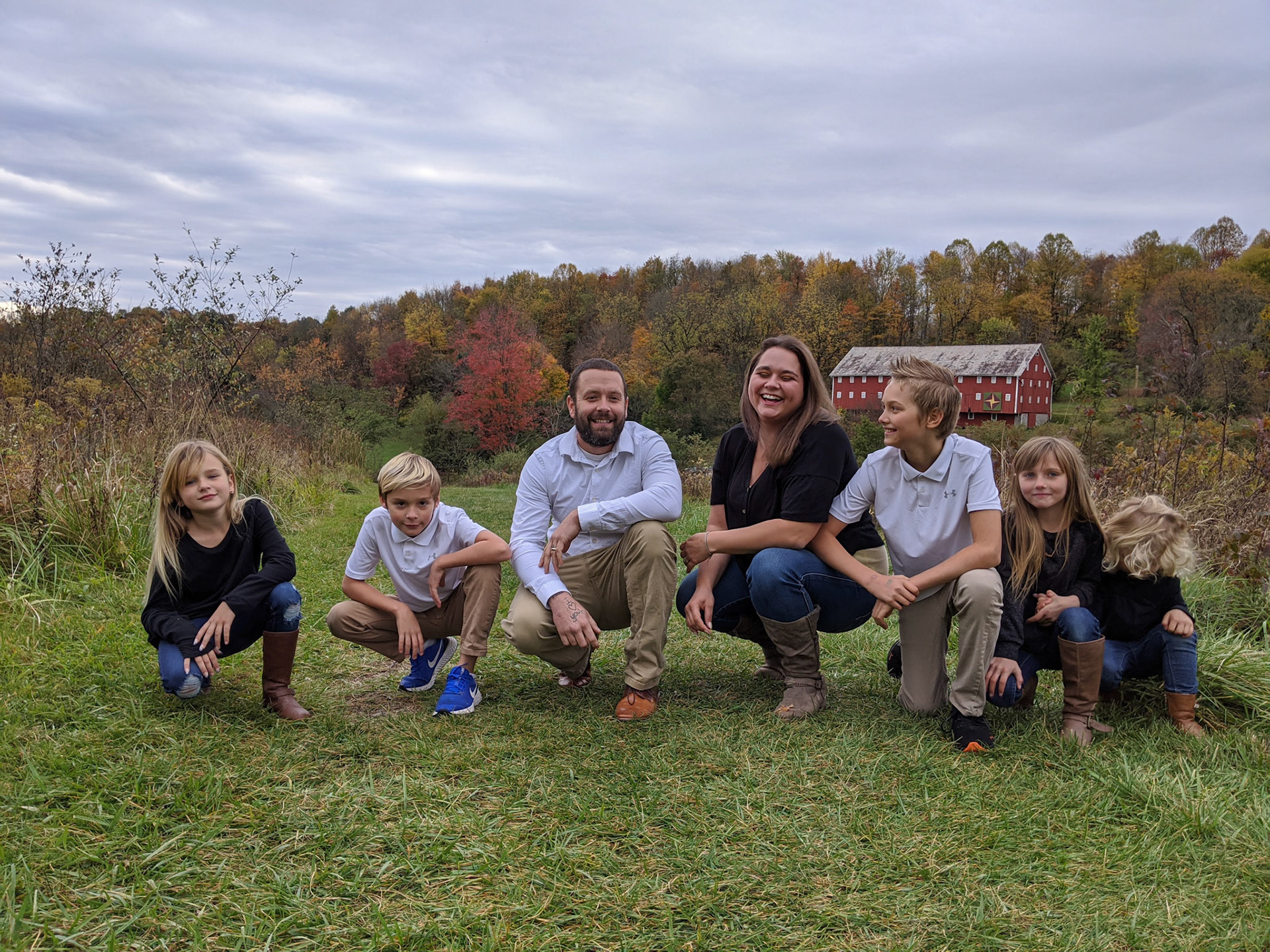 This is the first image in a number submitted by photographer for a final composite with all members grouped closer and looking at the camera. Multiple shots were used for final image.