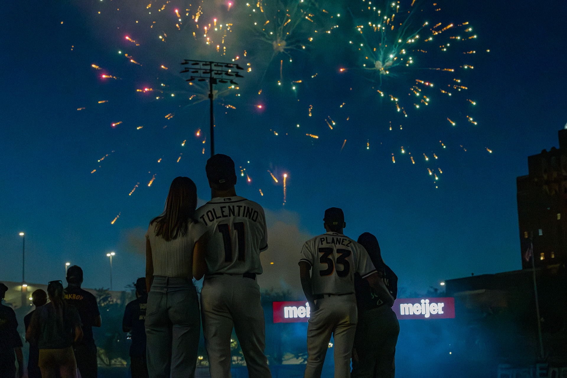 Milán Tolentino and Alexfri Planez watch fireworks with their significant others after the game at Canal Park on May 18 2024.