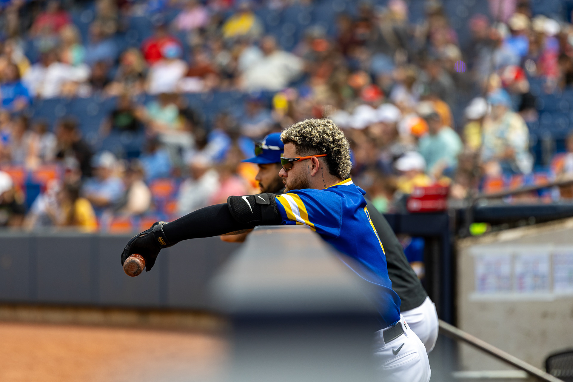 Micael Ramirez leans over the dugout at Canal Park on August 11 2024.