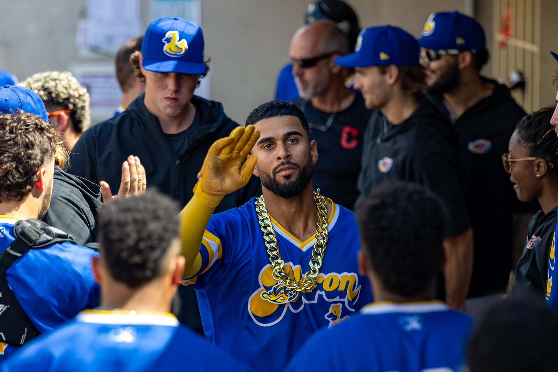 Yordys Valdes high fives his teammates in the dugout after a home run at Canal Park on August 11 2024.