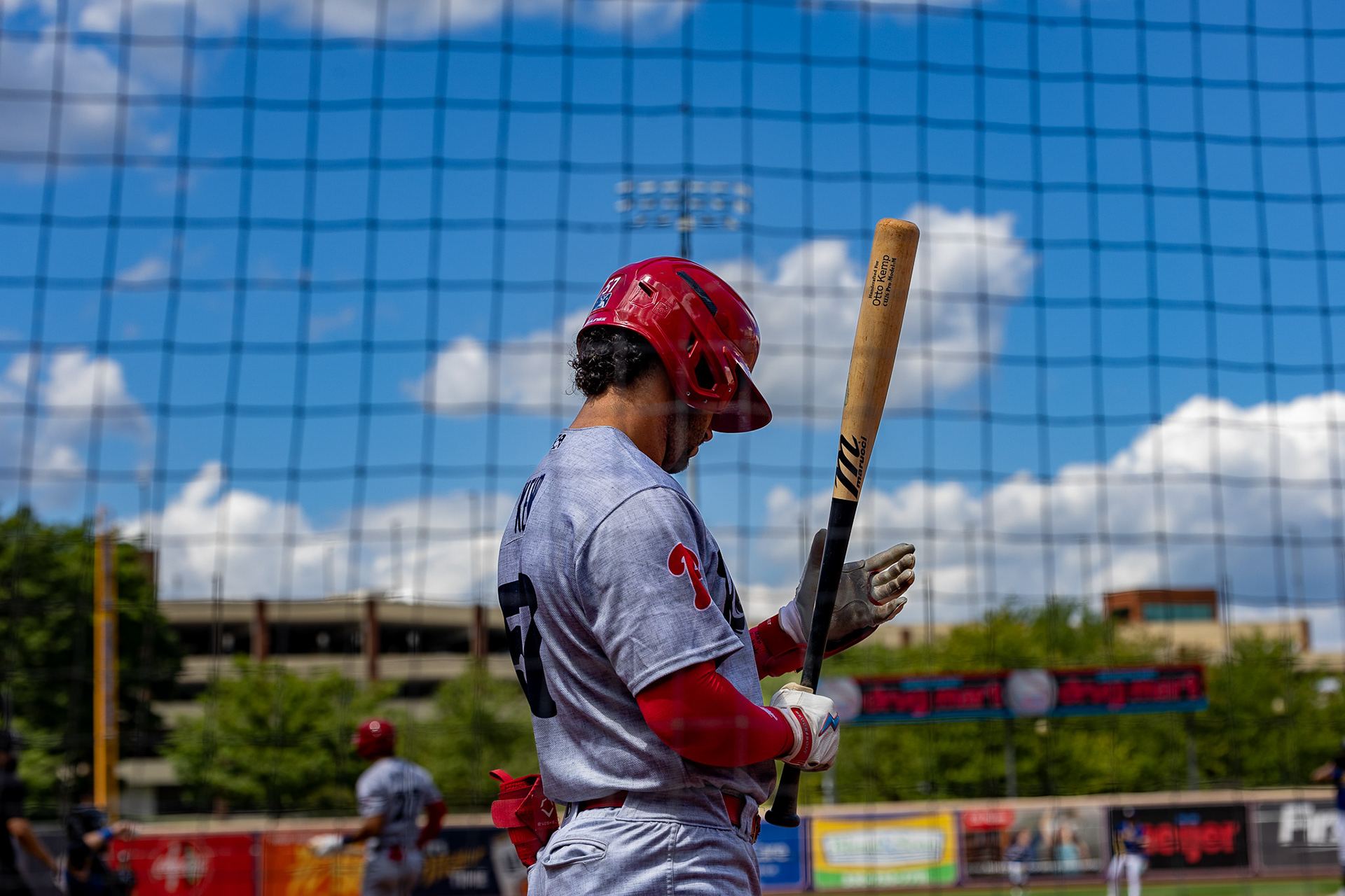 Otto Kemp tests out his bat before he heads to the plate at Canal Park on August 11 2024.