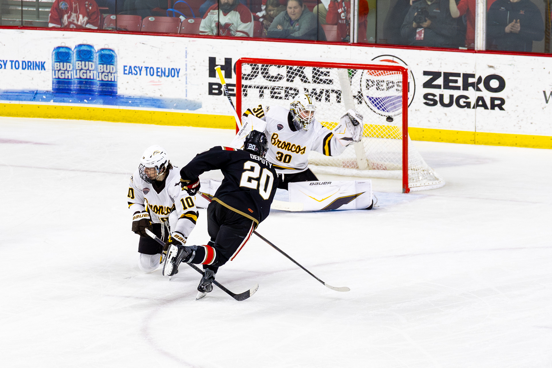 Miami Redhawks Forward #20, David Deputy, scores the GWG in overtime against Western Michigan to win 3-2 at Goggin Ice Center on February 6 2026.