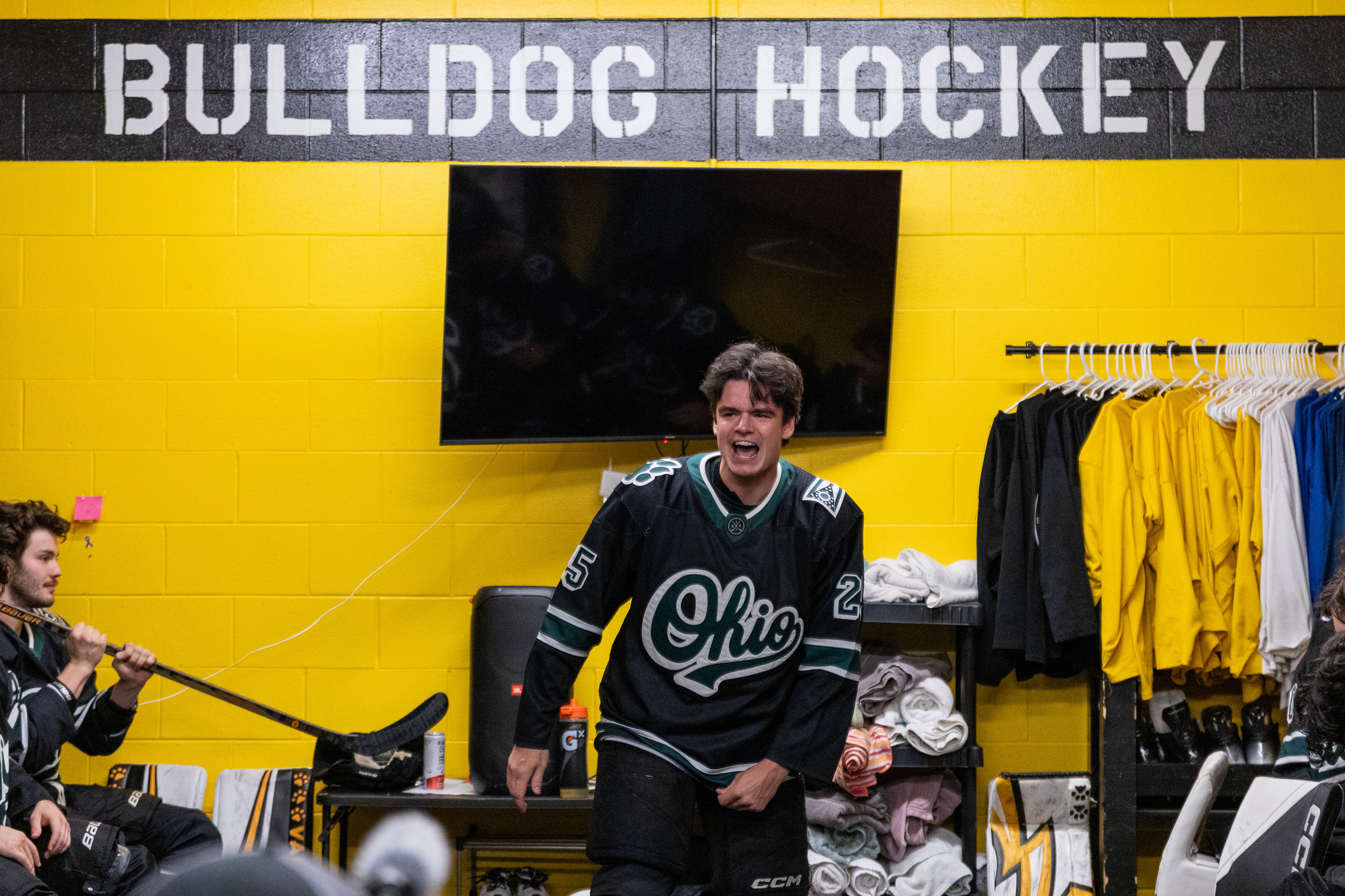 Ohio Bobcats Forward #25, Xander Danner, announces the starting lineup in the locker room before a game against Adrian at Arrington Ice Arena on October 23 2025.