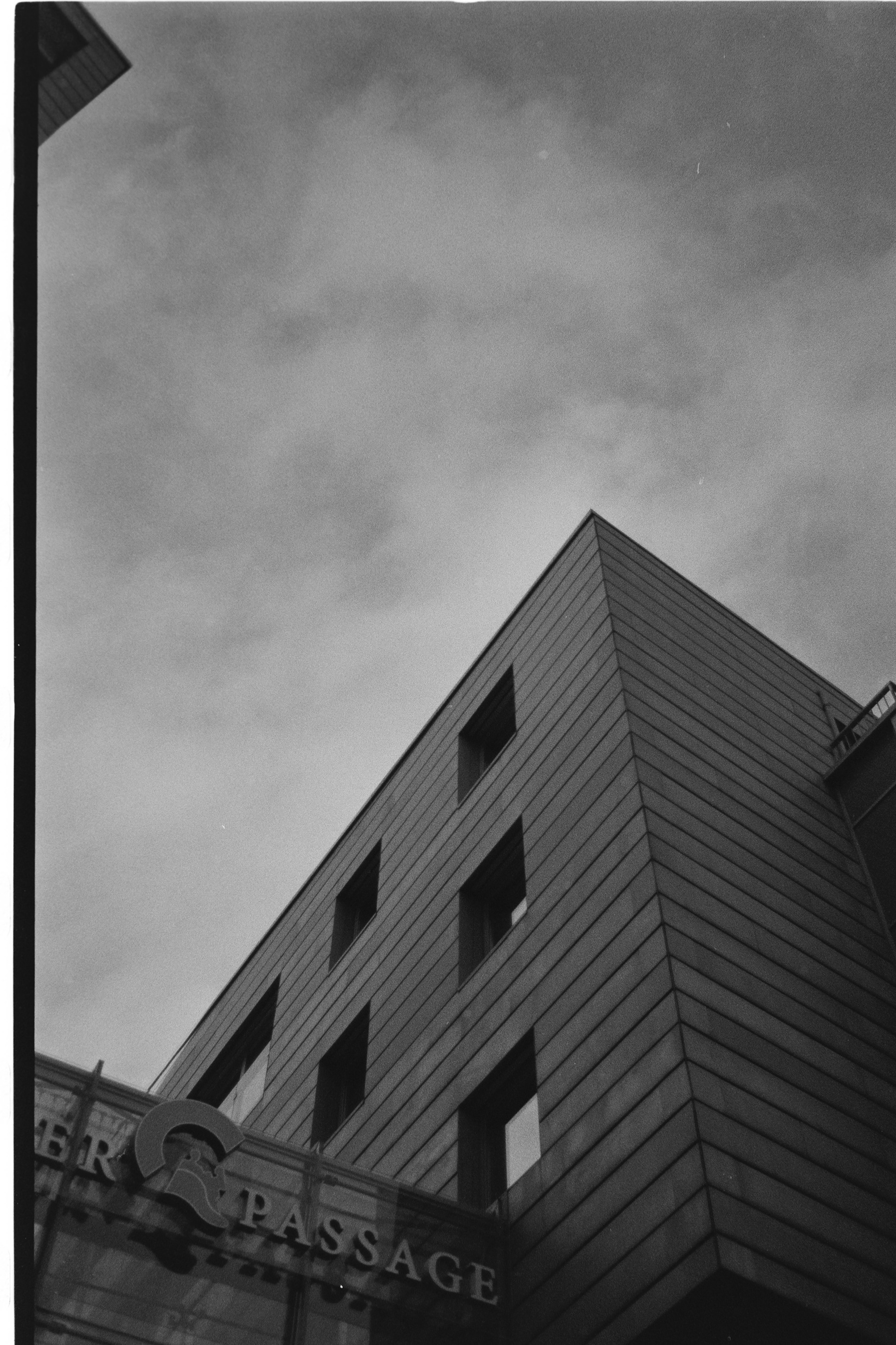 Clouds and Buildings: Pentax ME 50mm f/1.7 Ilford Delta 400