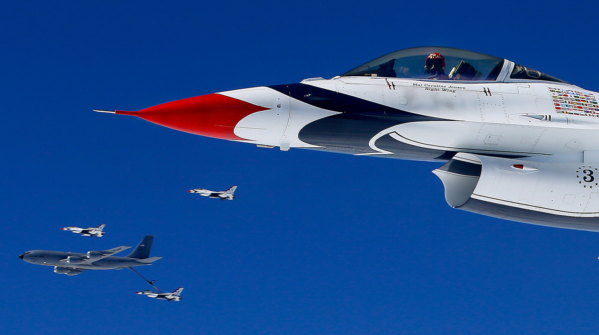 Maj. Caroline Jensen of the U.S. Air Force Thunderbirds, right, waits to be pumped with fuel by a KC-135 of the Kansas Air National Guard's 190th Air Refueling Wing Thursday June 12, 2014, over New Mexico.