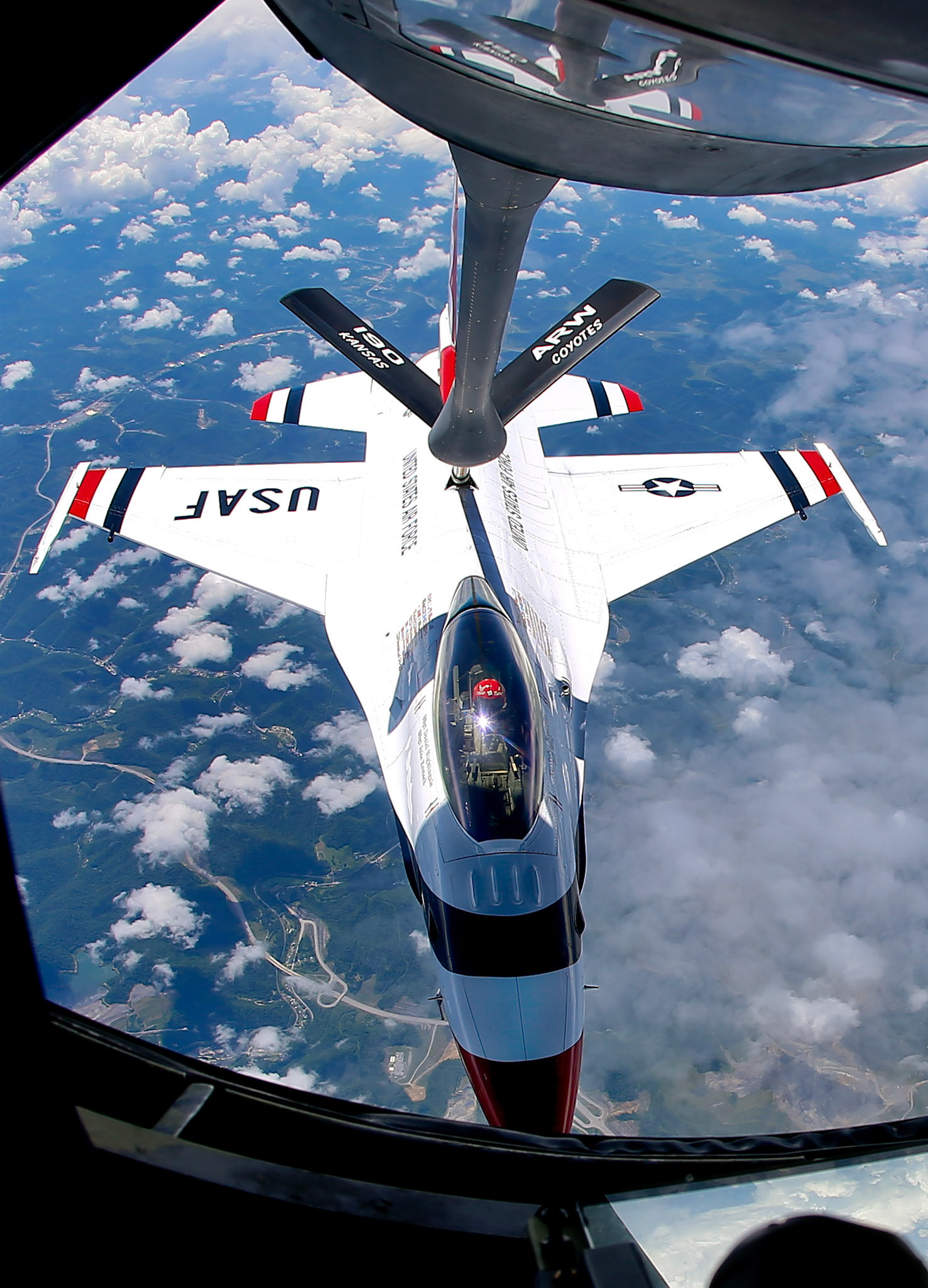 A U.S. Air Force Thunderbird takes in fuel from a KC-135 of the Kansas Air National Guard's 190th Air Refueling Wing Thursday June 12, 2014, over West Virginia. The planes were heading from a show in Las Vegas to another air show in West Virginia.