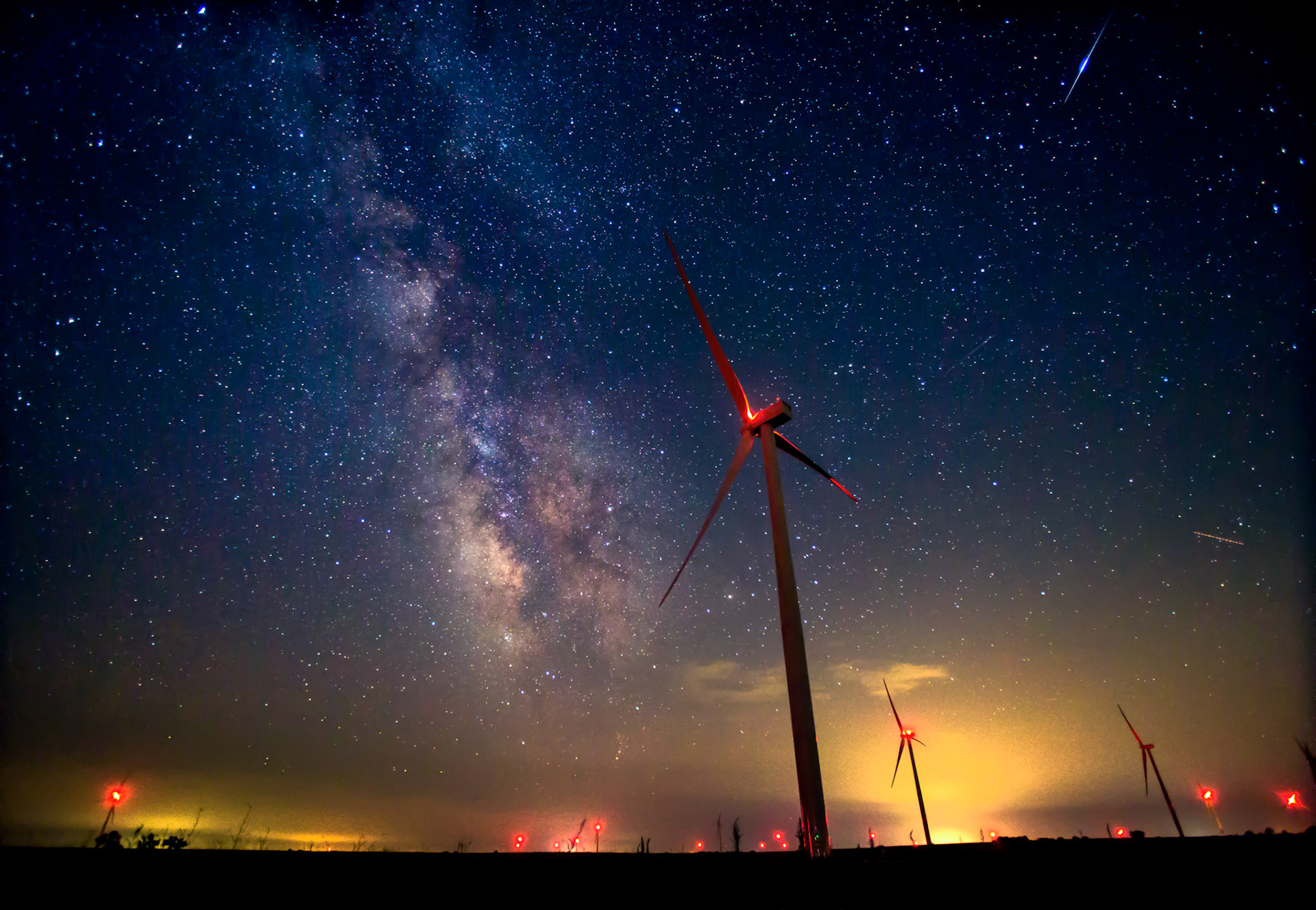 The Milky Way shines brightly over a wind farm outside of Waverly, Kan., on July 23, 2017. (Chris Neal/The Capital-Journal)