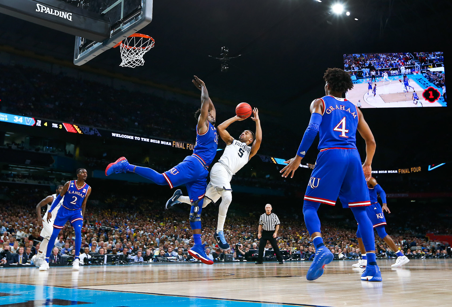Kansas loses in the Final Four, 95-79, to Villanova's barrage of 3-pointers. Villanova set a Final Four record with 14 made threes.