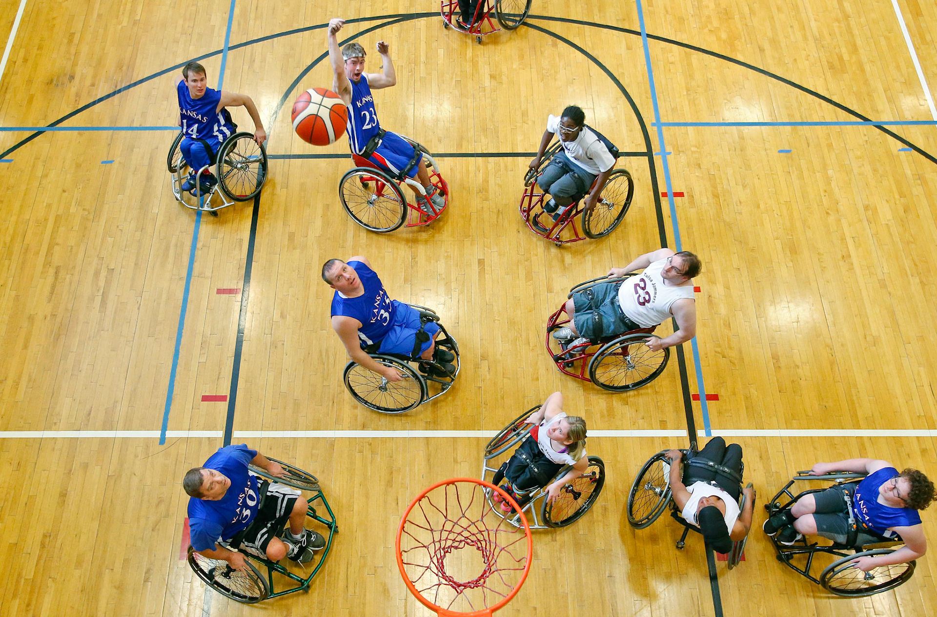 Zachary Herries, top center, of Eudora, takes a shot Feb. 11 at the 3rd annual KC Classic Wheelchair Basketball Tournament. The Wheelhawks defeated the Tulsa Jammers 64-38 and advanced to the next round. 