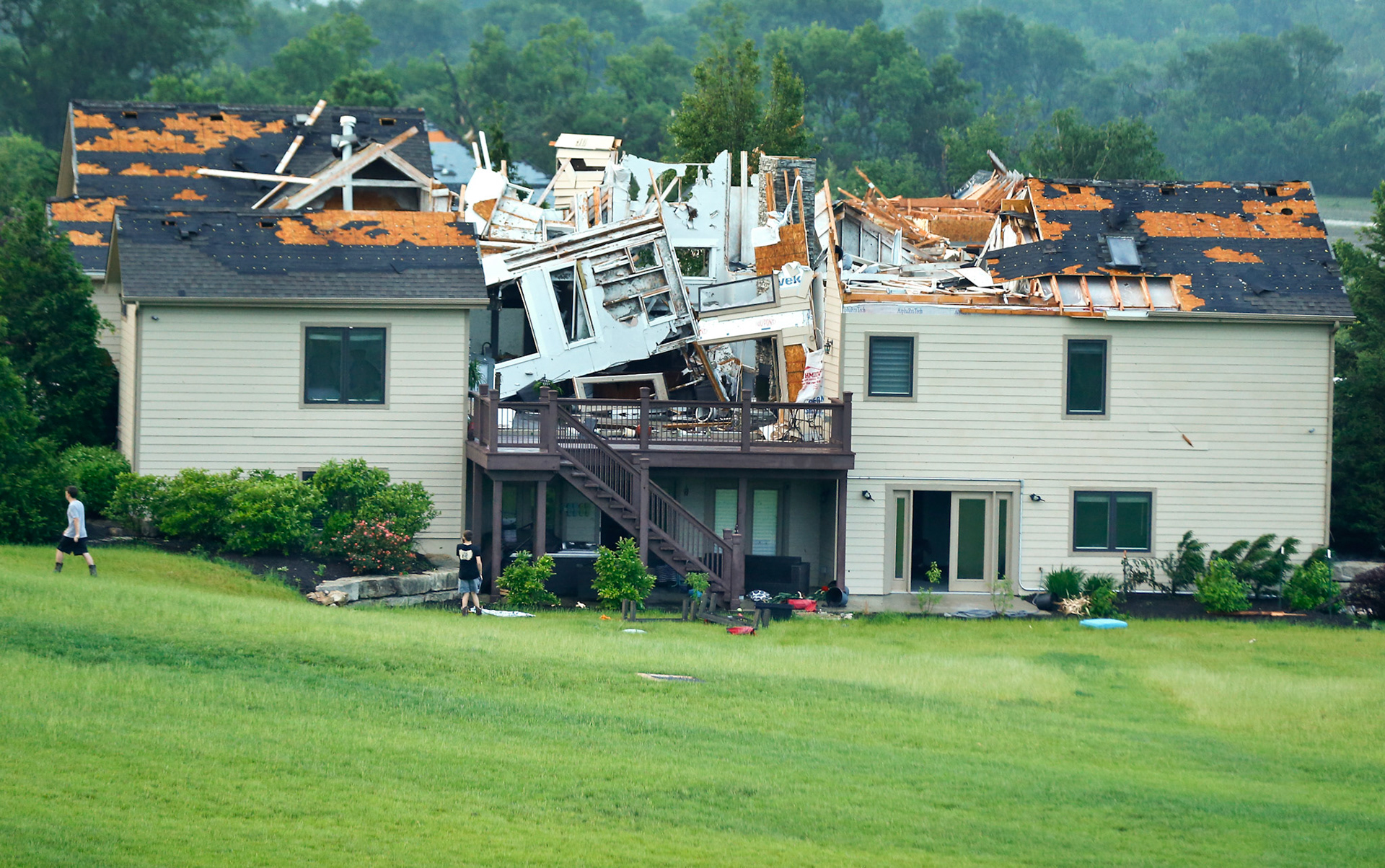 A destroyed home sits in a neighborhood after it was hit by a tornado Tuesday night south of Lawrence near US-59 highway and N. 1000 Road. [Chris Neal/The Capital-Journal]